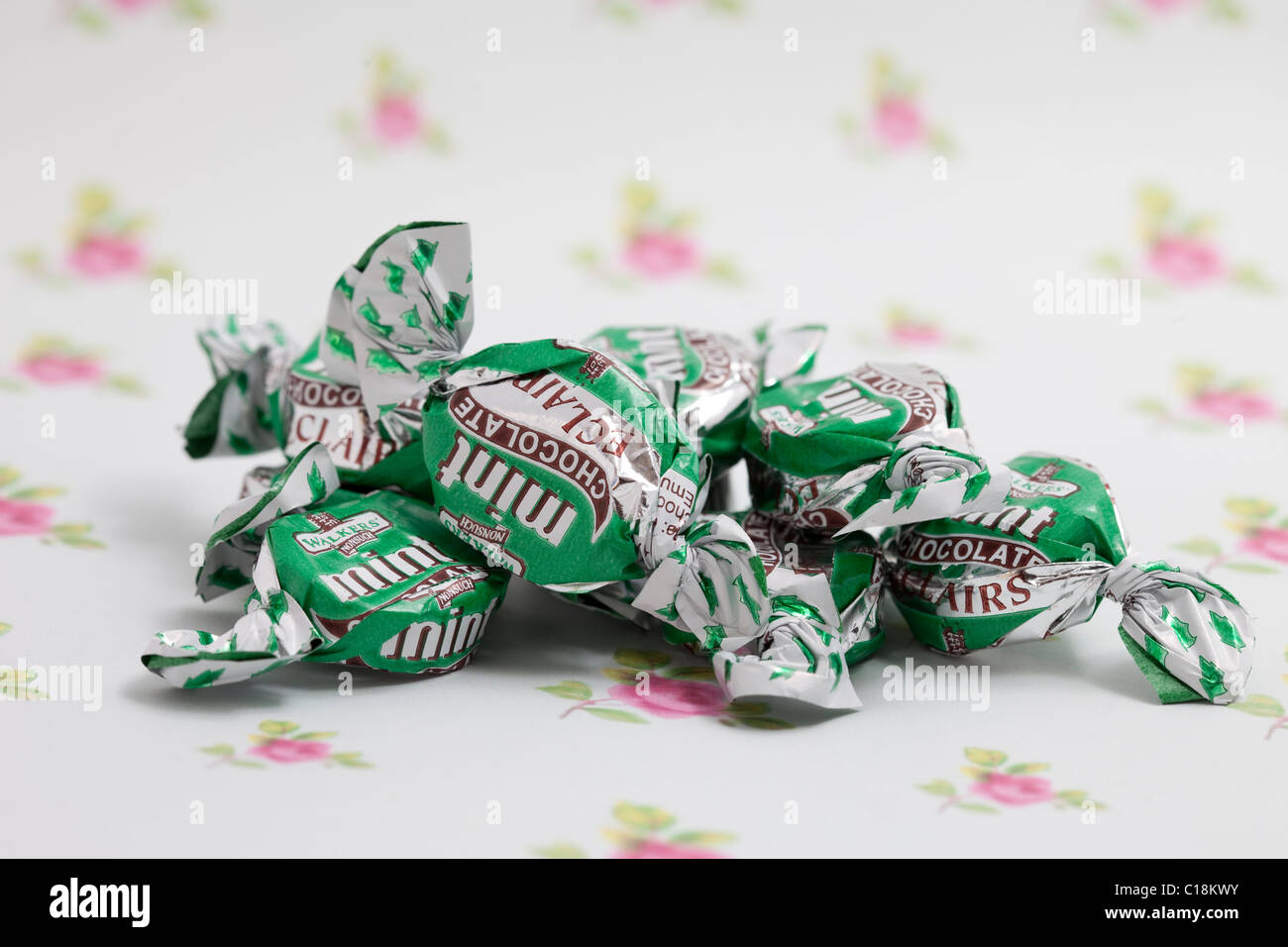 mint chocolate eclairs sweets and candy on a paper background photographed in a studio Stock Photo