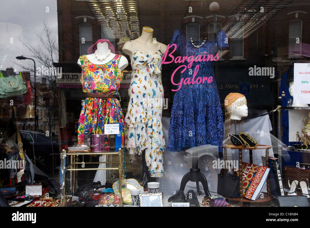 Bargains galore,charity shop window display, London Stock Photo Alamy