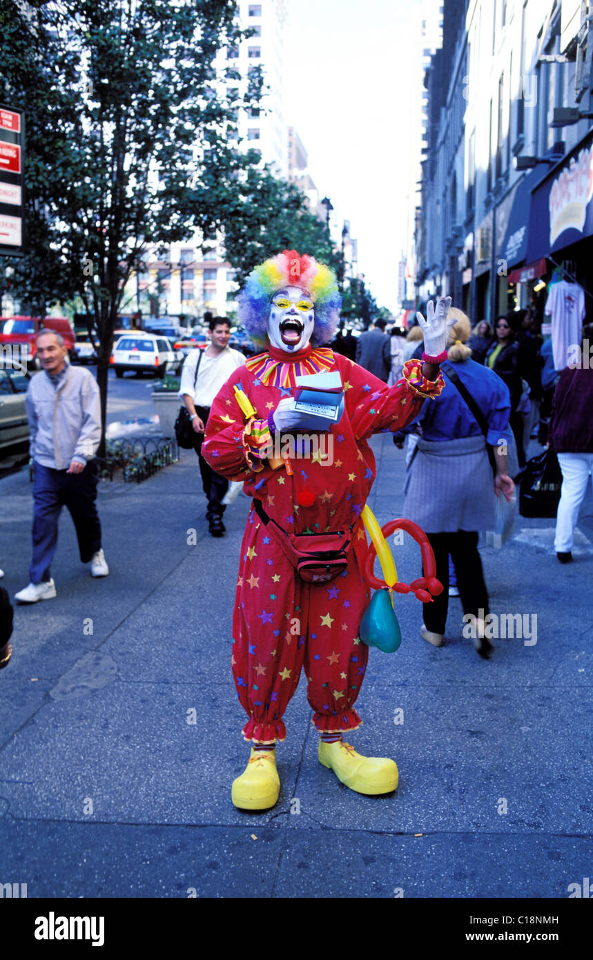 United States, New York City, Manhattan, W 34 street, clown promotes a shop Stock Photo