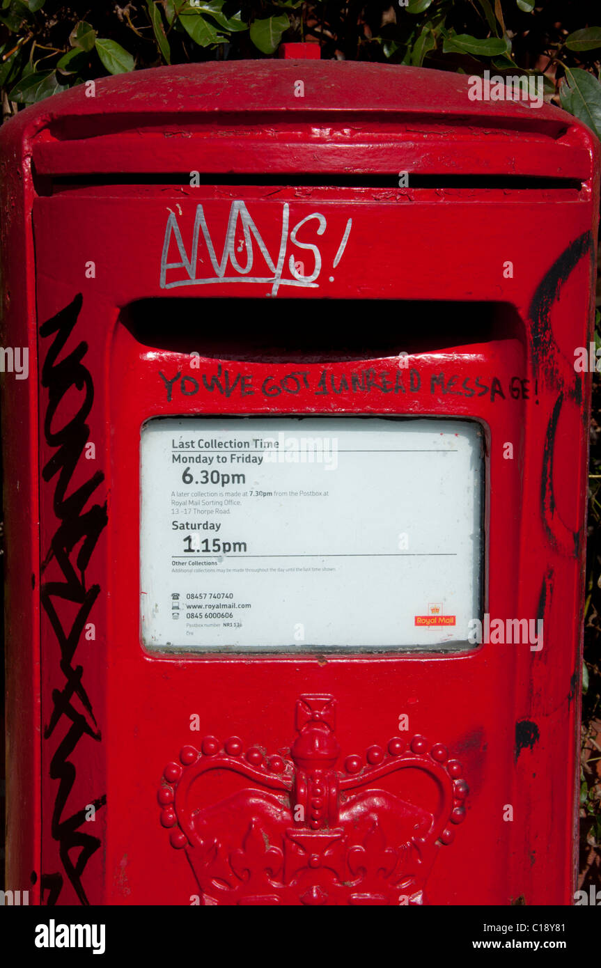 Red post box with graffiti about e mail/text You have 1 unread Message Stock Photo