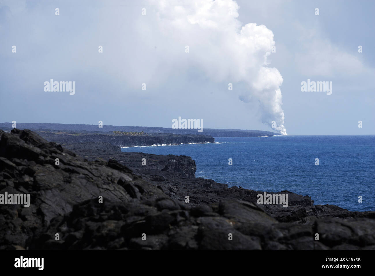 Active streams of lava flowing into the ocean in Volcano Park on the south coast of Big Island, Hawaii, USA Stock Photo