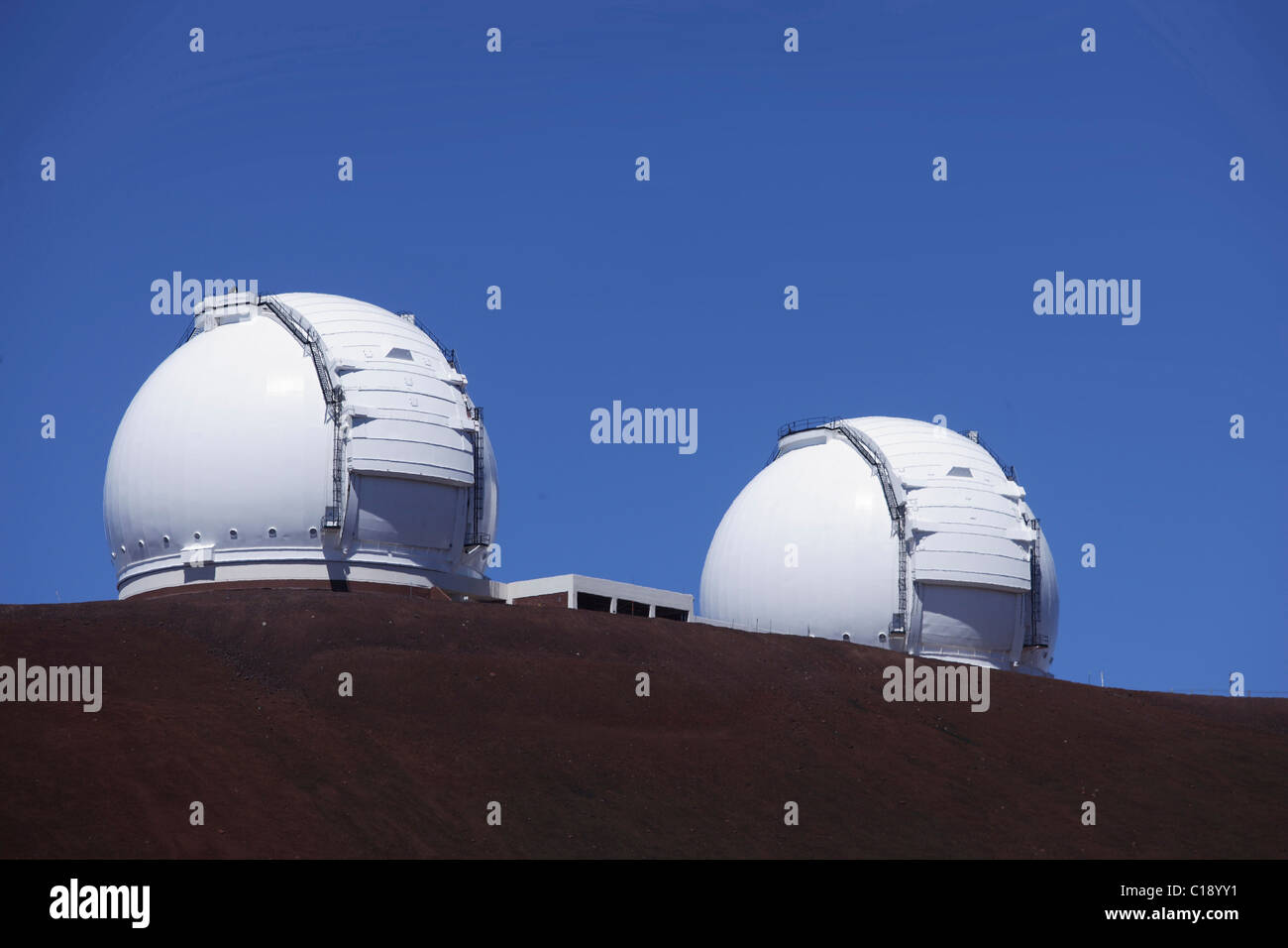 Domes of the two Keck telescopes near the summit of the extinct volcano Mauna Kea, Hawaii, USA Stock Photo