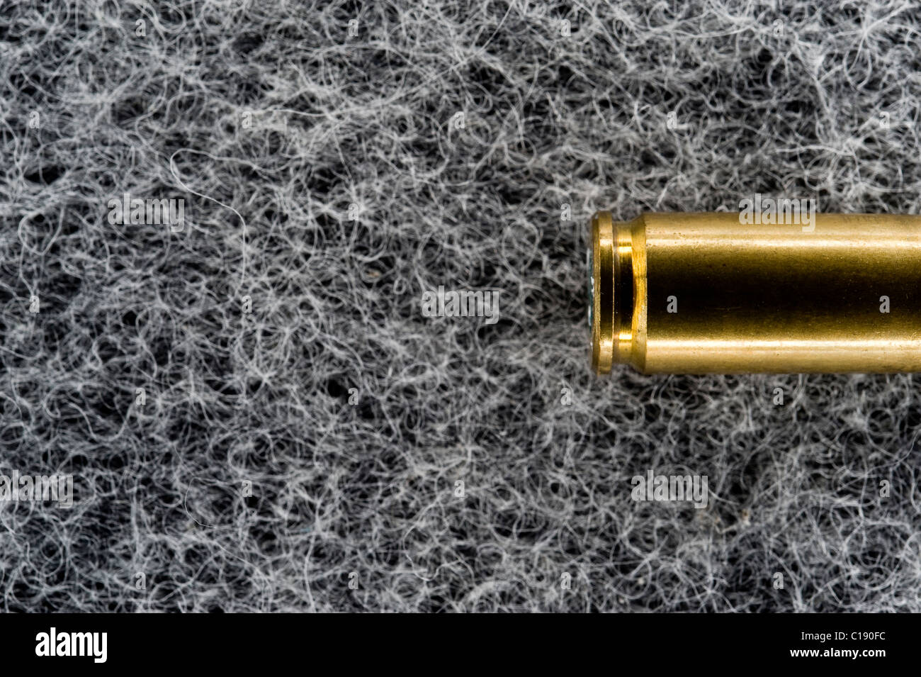 Bullet case on a soft surface Stock Photo