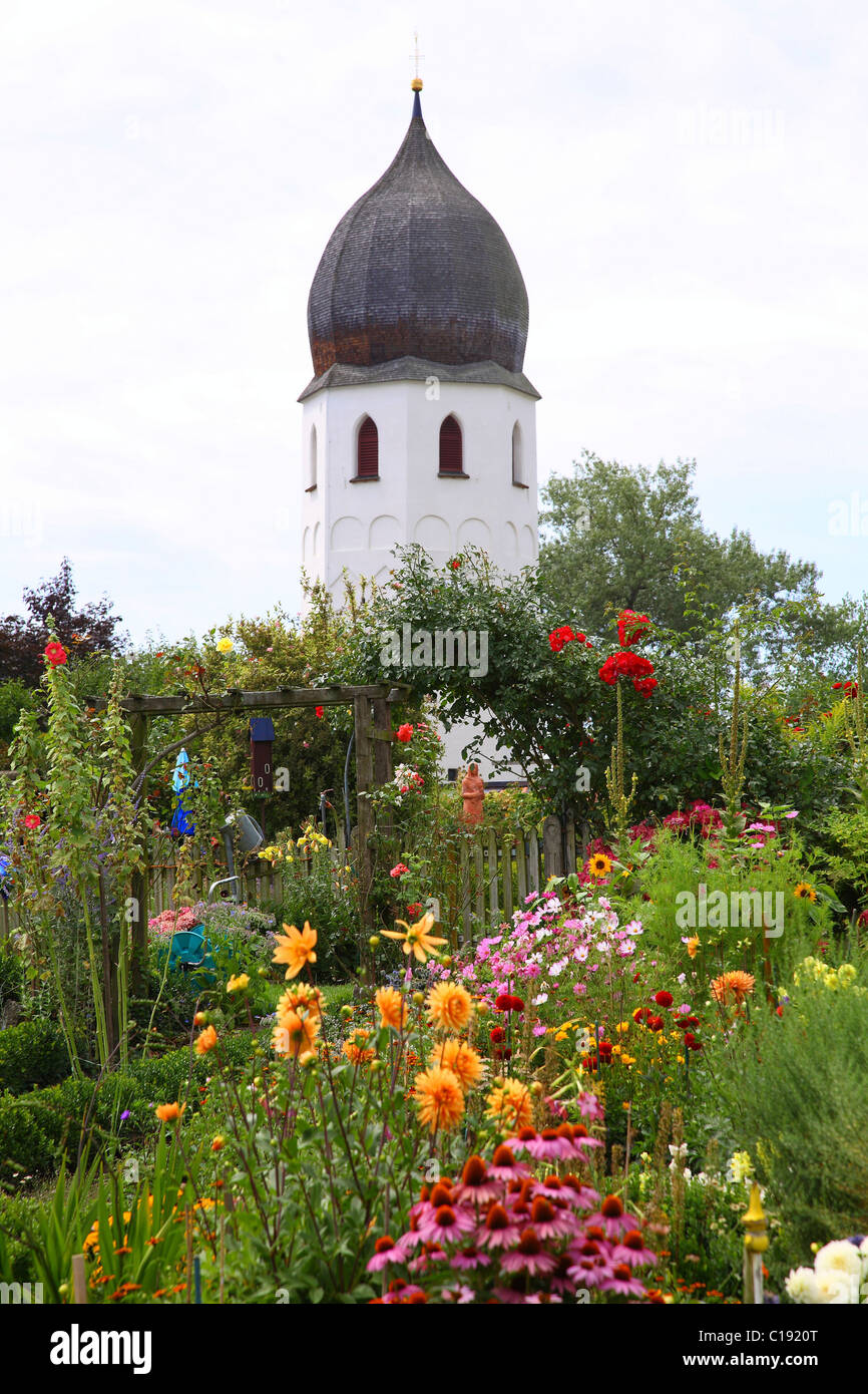 Abbey garden, bell-tower of Frauenwoerth Abbey, Fraueninsel or Frauenchiemsee Island, Chiemsee lake, Germany, Europe Stock Photo