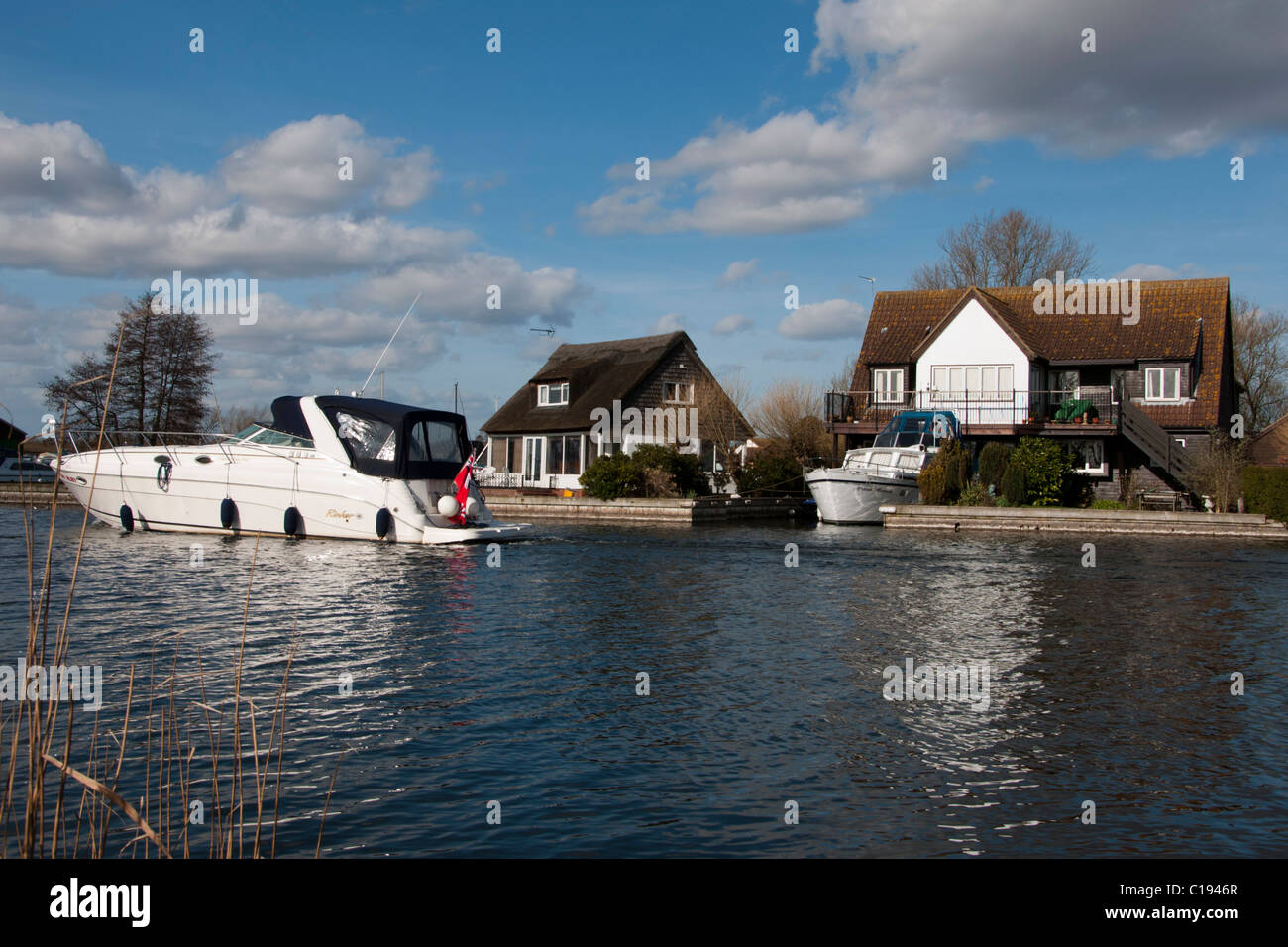 River front house with Boat parked River Bure Norfolk Broads Stock