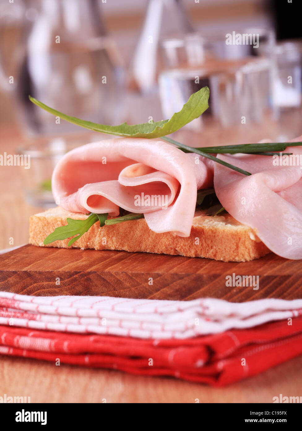 Open faced ham sandwich with greens and chives Stock Photo - Alamy