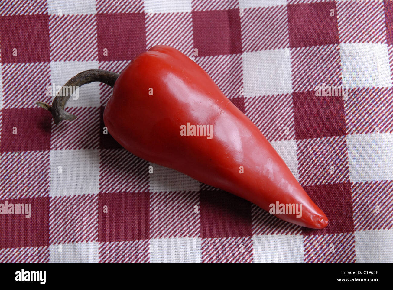Red chile pepper on red-checked cloth Stock Photo - Alamy