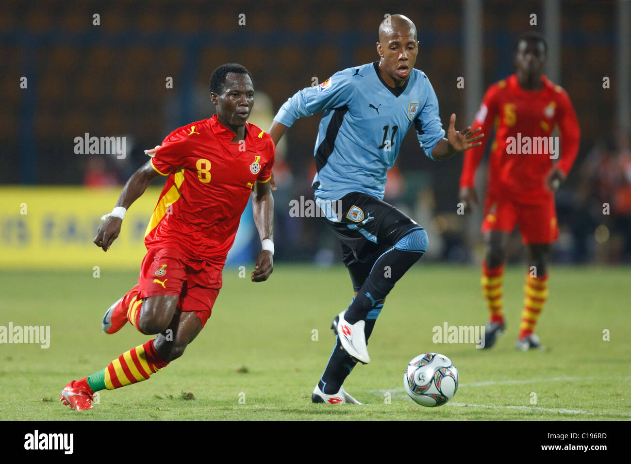 Emmanuel Agyemang Badu of Ghana (8) drives the ball against Abel Hernandez of Uruguay (11) during a FIFA U-20 World Cup match. Stock Photo