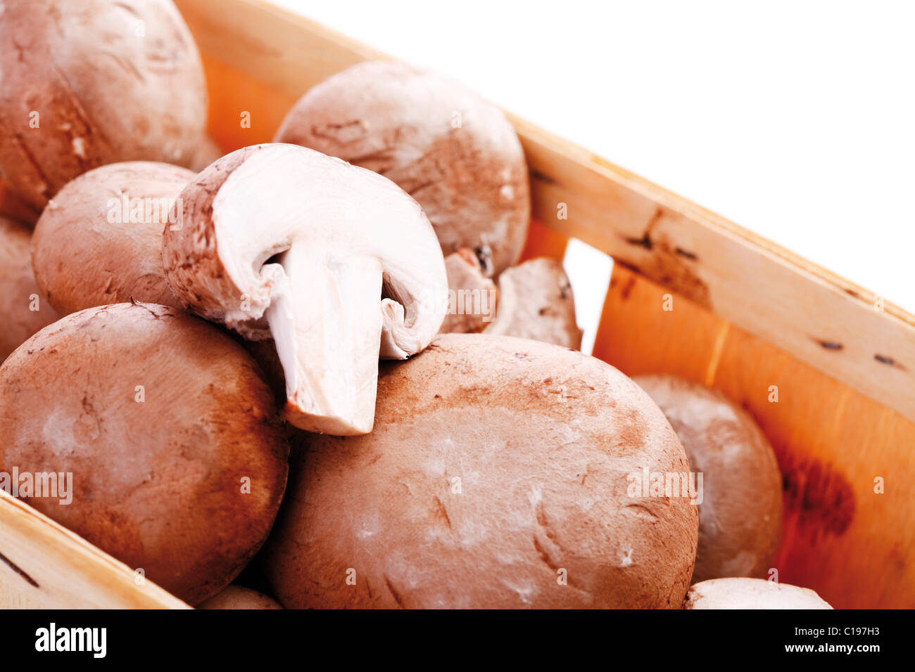 Brown mushrooms in a wooden box Stock Photo