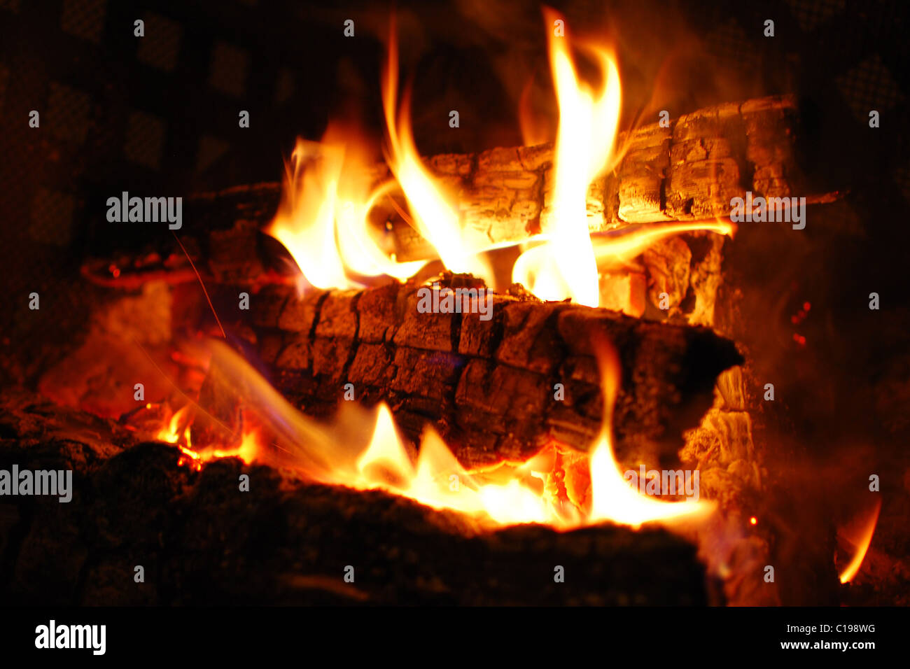 Logs burning in fireplace glowing hi-res stock photography and images ...