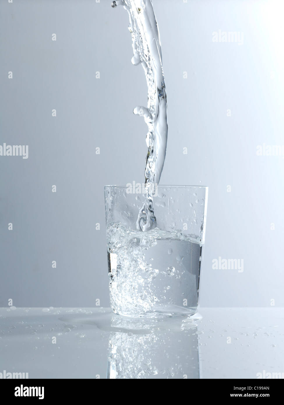 Water being poured into a glass Stock Photo Alamy