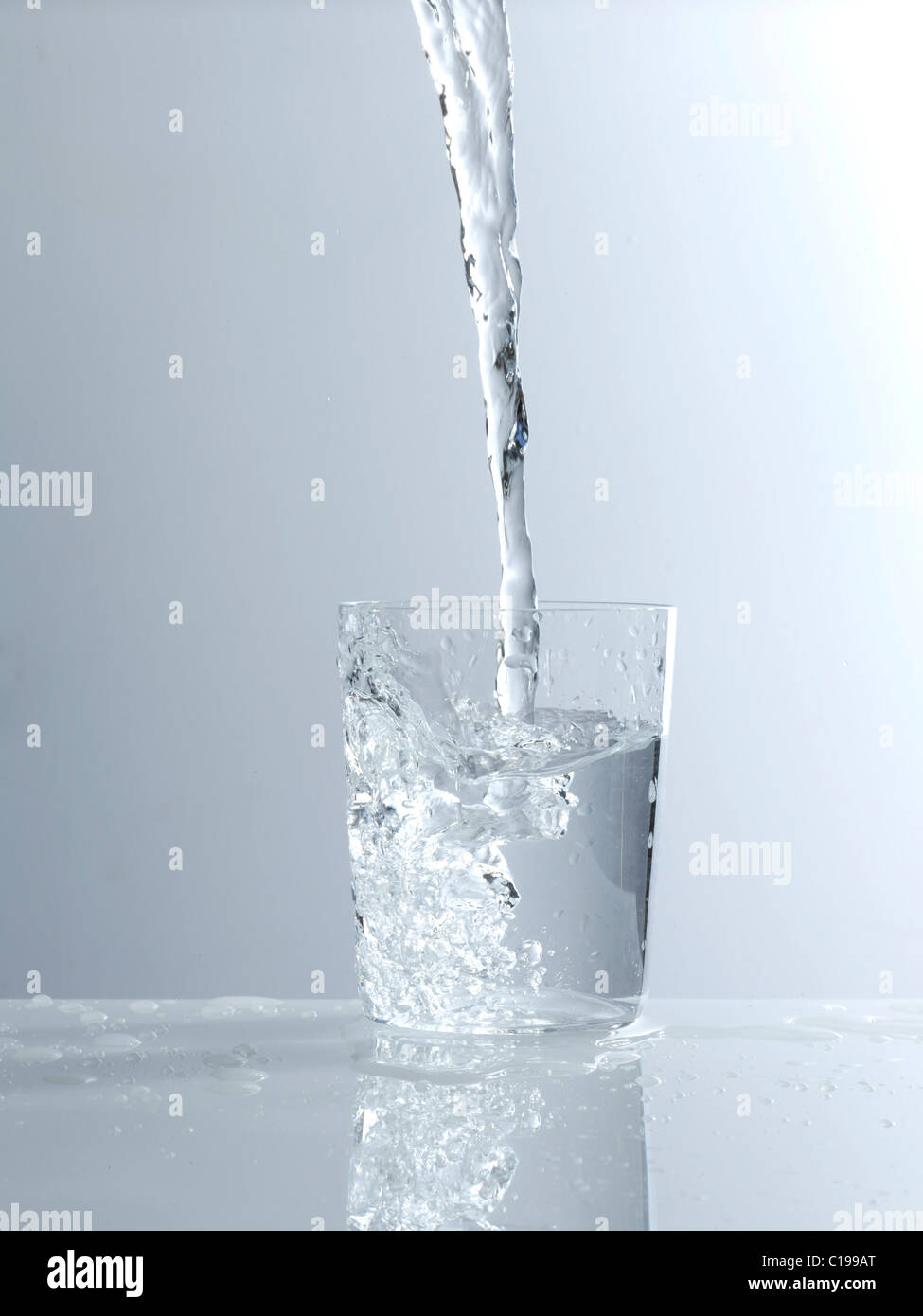 Water Being Poured Into A Glass Stock Photo - Alamy