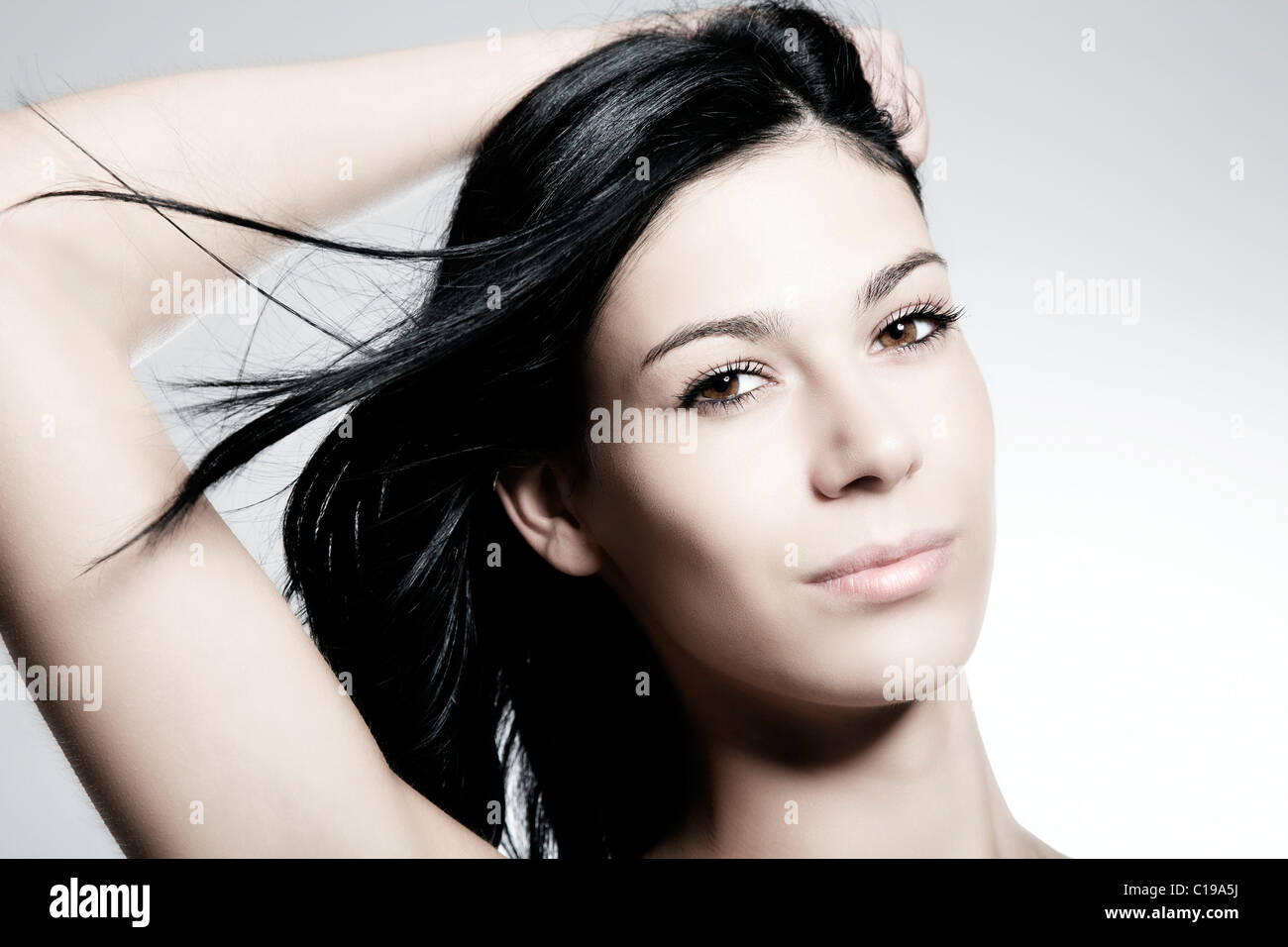 Portrait of a young darkhaired woman Stock Photo Alamy