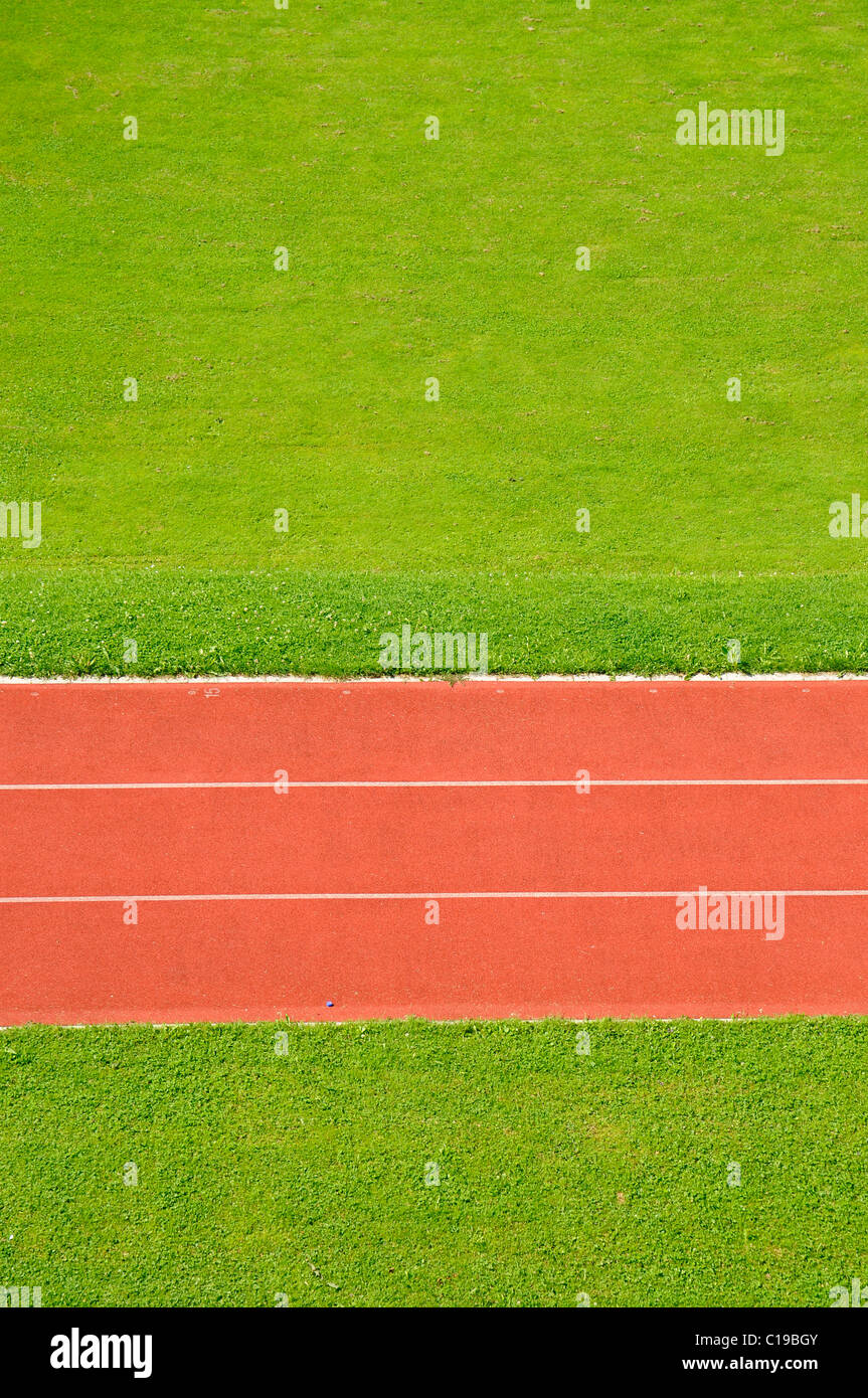 Straight, straight running track, race track, sprint track, markings, red, green, lawn, sports ground Stock Photo