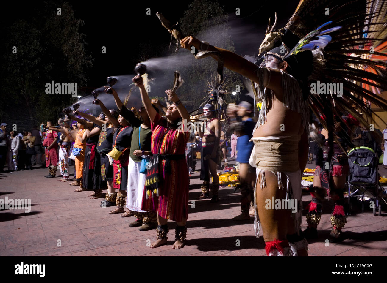 Pre-hispanic (Aztec) dance group performing a ritual on the day of the dead in Xochimilco, Mexico Stock Photo