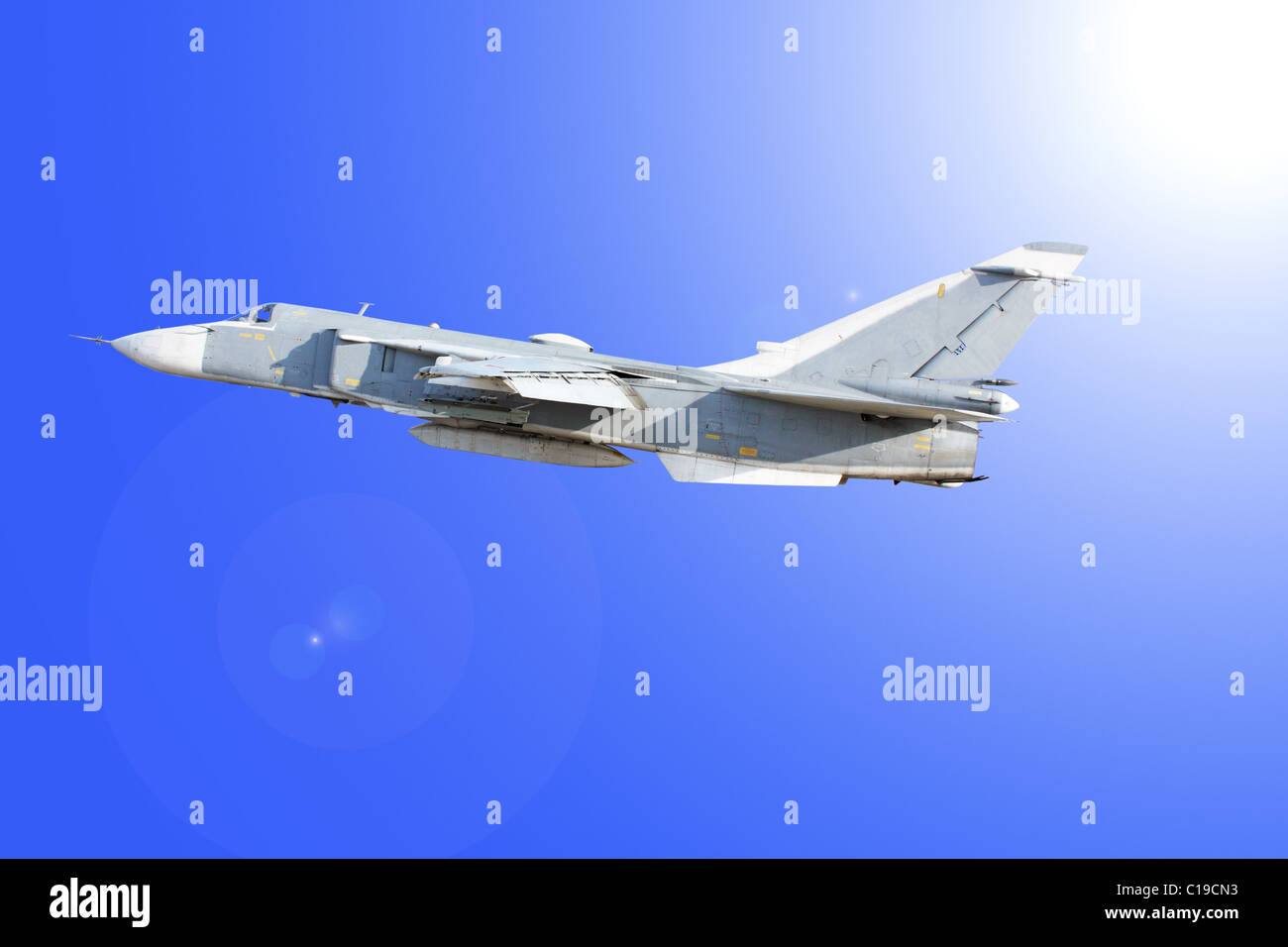 Military jet bomber Su-24 against the blue sky Stock Photo