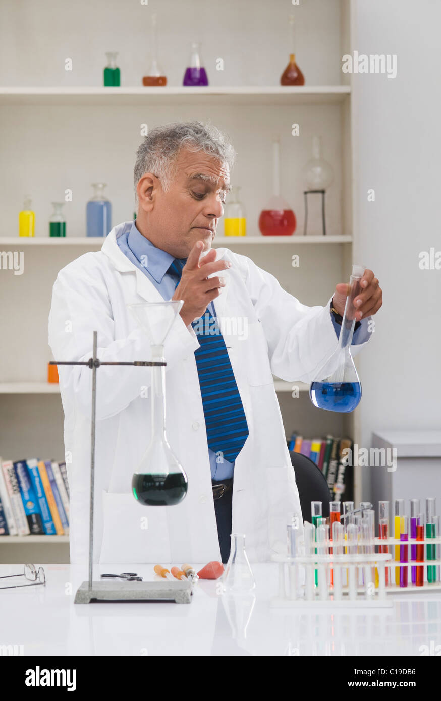 Scientist doing scientific experiment in a laboratory Stock Photo