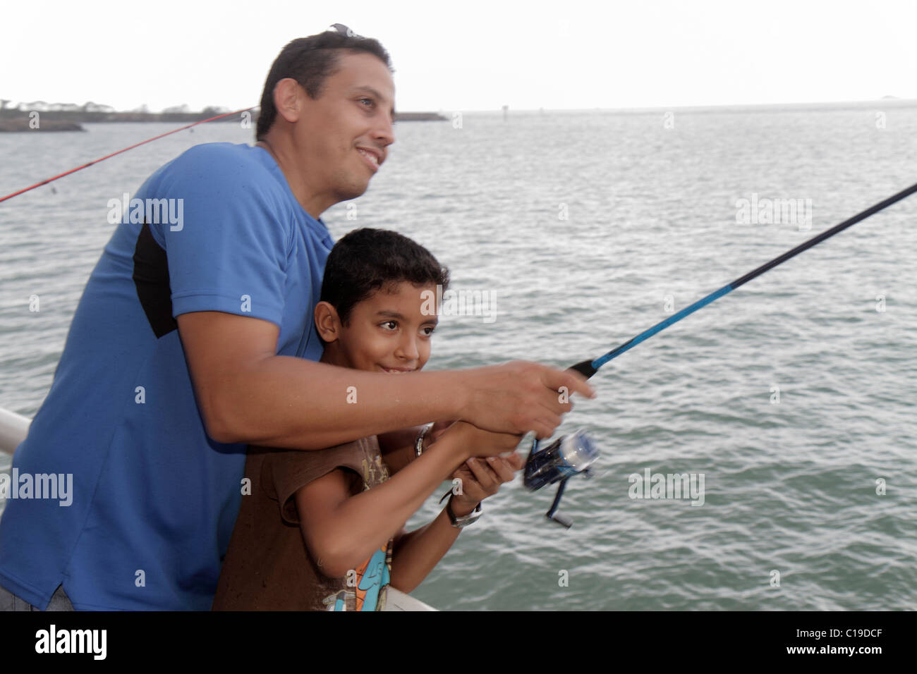 Panama,Latin,Central America,Panama City,Amador Causeway,Calzada de Amador,Bahia de Panama,Panama Canal,fishing,pier,rod,reel,sport,Hispanic Latin Lat Stock Photo