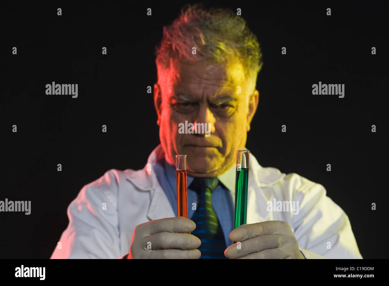 Scientist examining test tubes Stock Photo Alamy