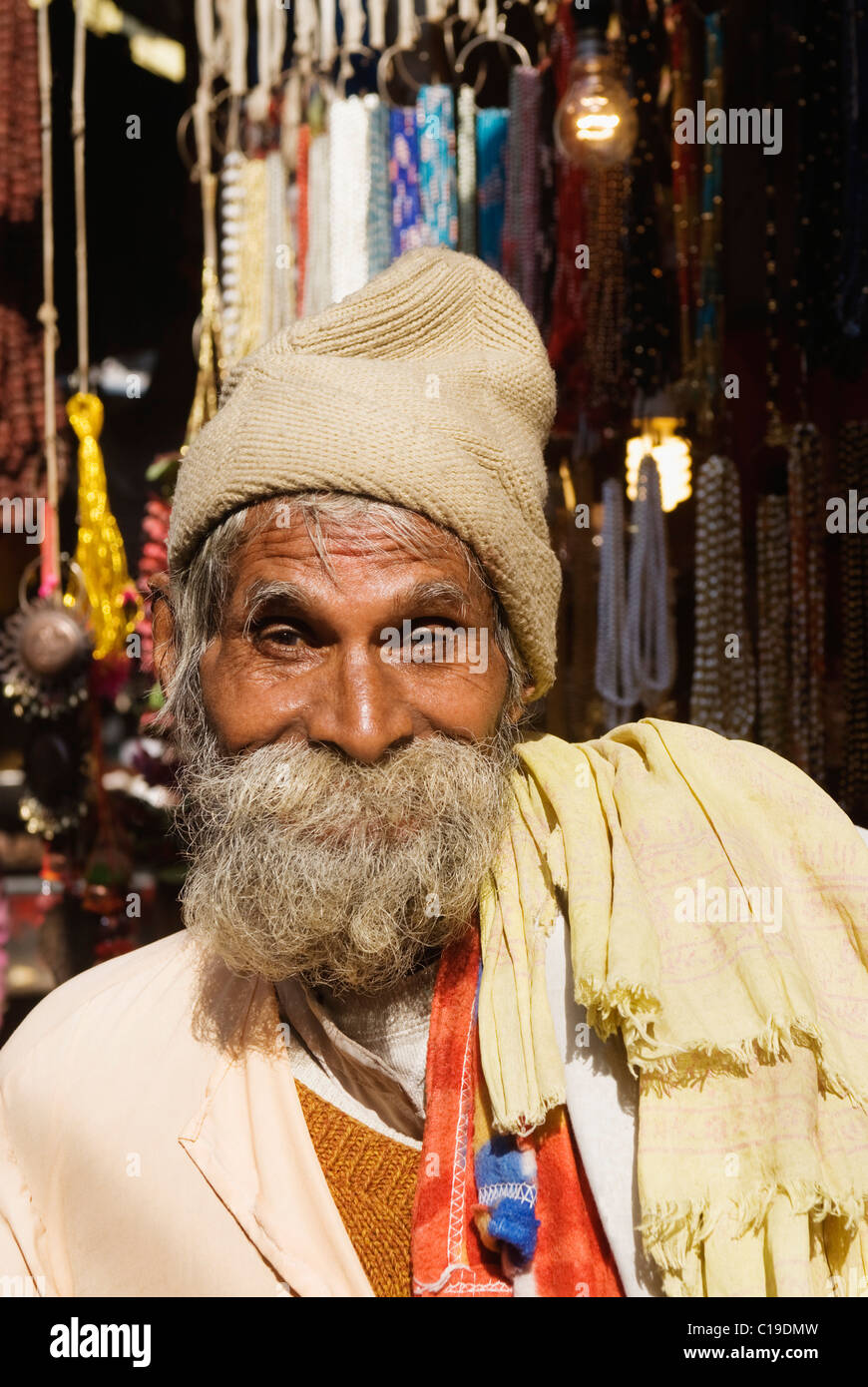 Man smiling at a street market, Haridwar, Uttarakhand, India Stock Photo