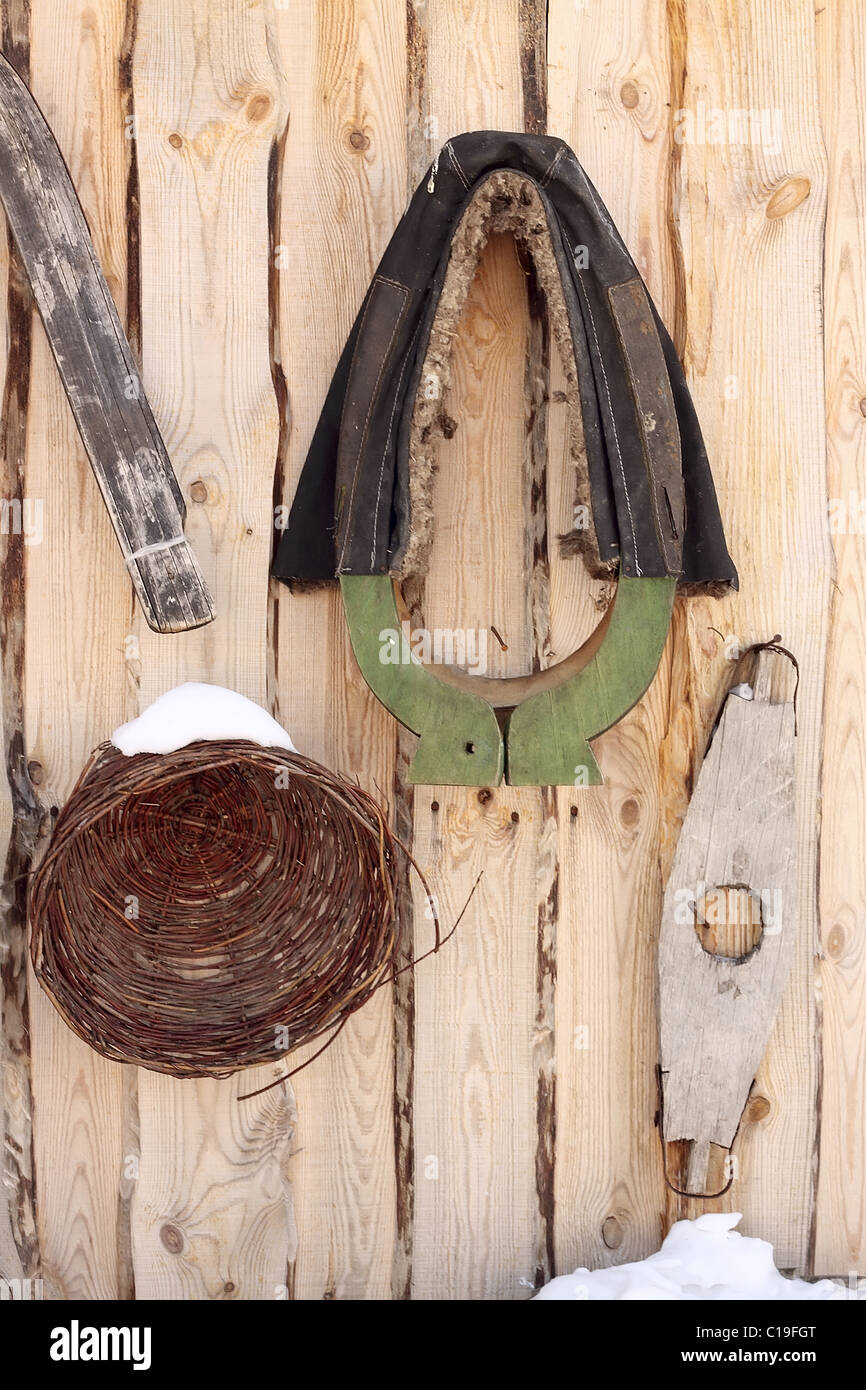 Utensils and horse harness in the rural house Stock Photo