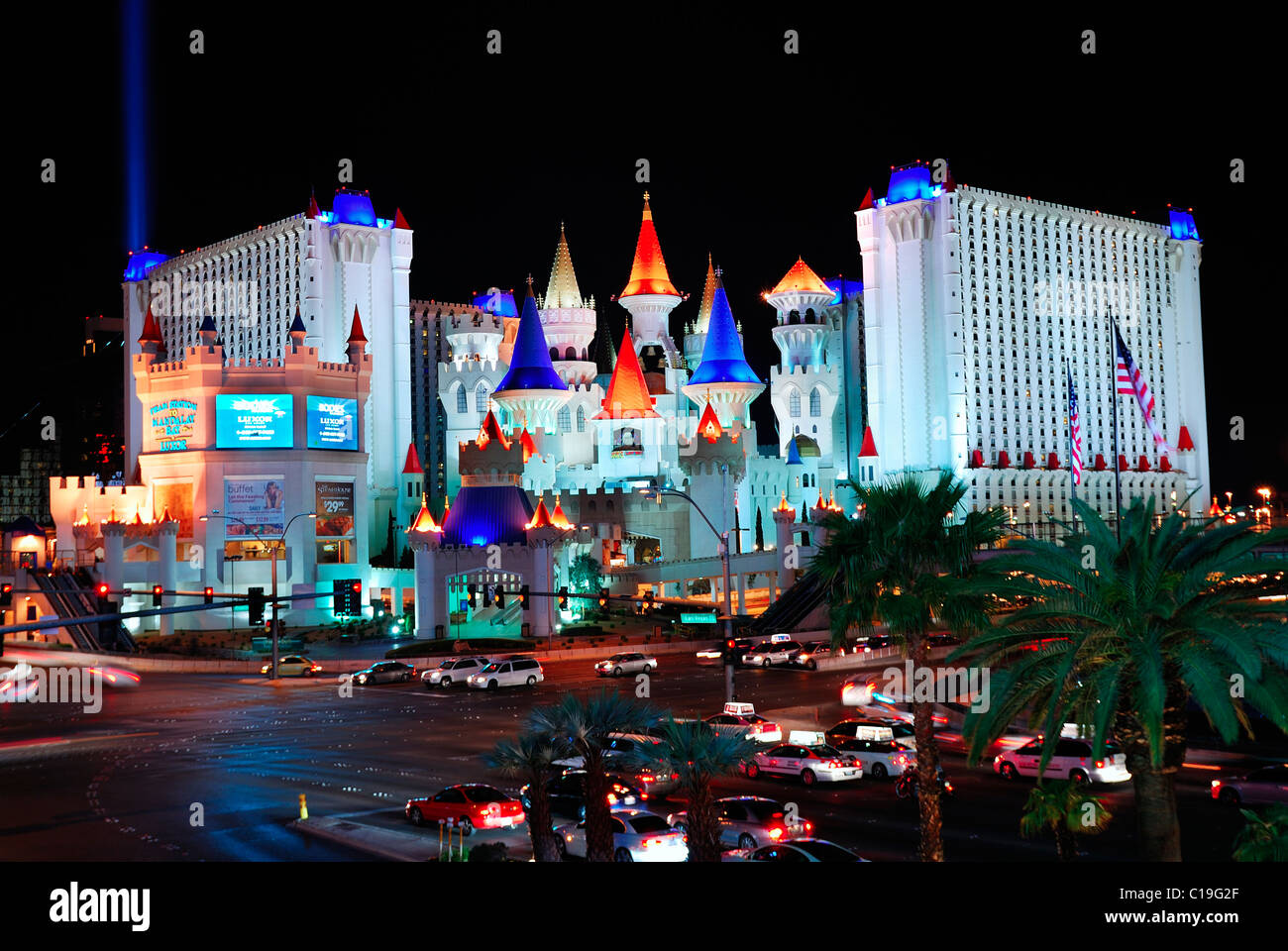 Excalibur Hotel and Casino, Las Vegas at night with busy traffic Stock Photo