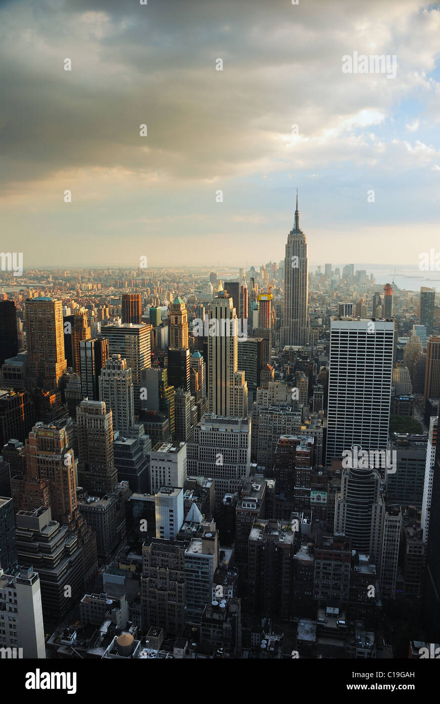 Empire state building, New York City at sunset with manhattan skyline ...