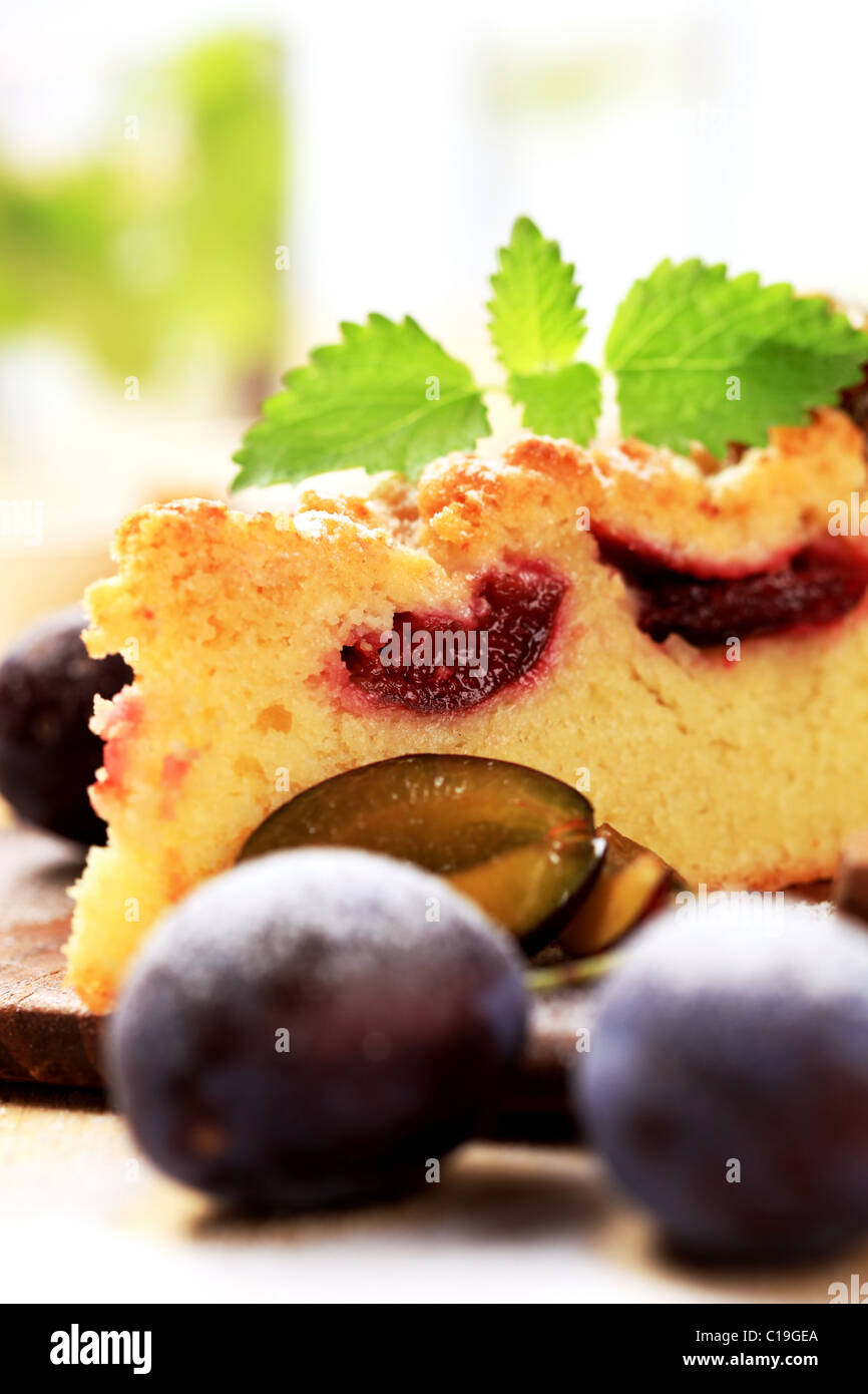 Slice of plum cake with crumb topping Stock Photo - Alamy