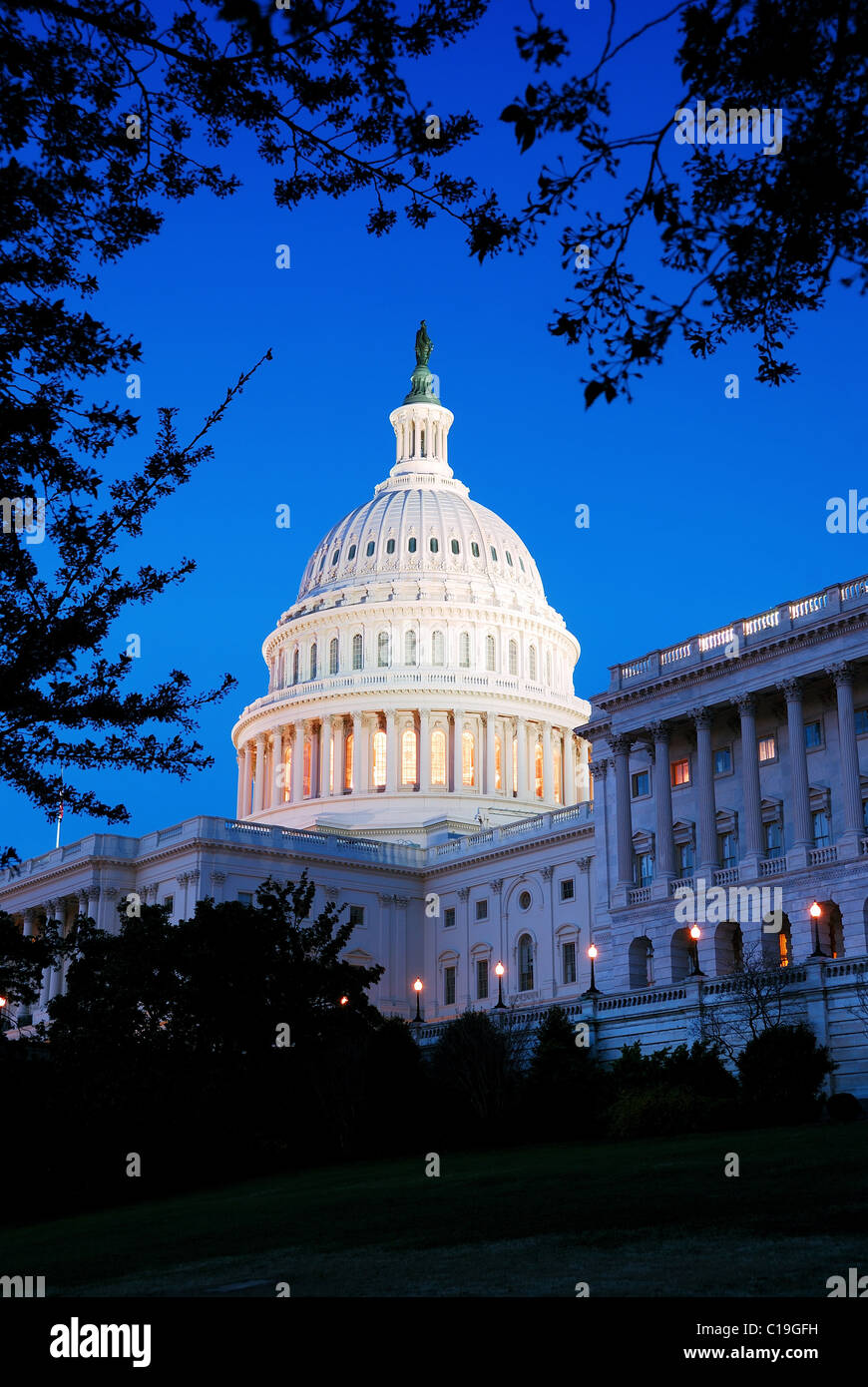 Capitol Hill Building dome at dusk with light and blue sky, Washington DC. Stock Photo