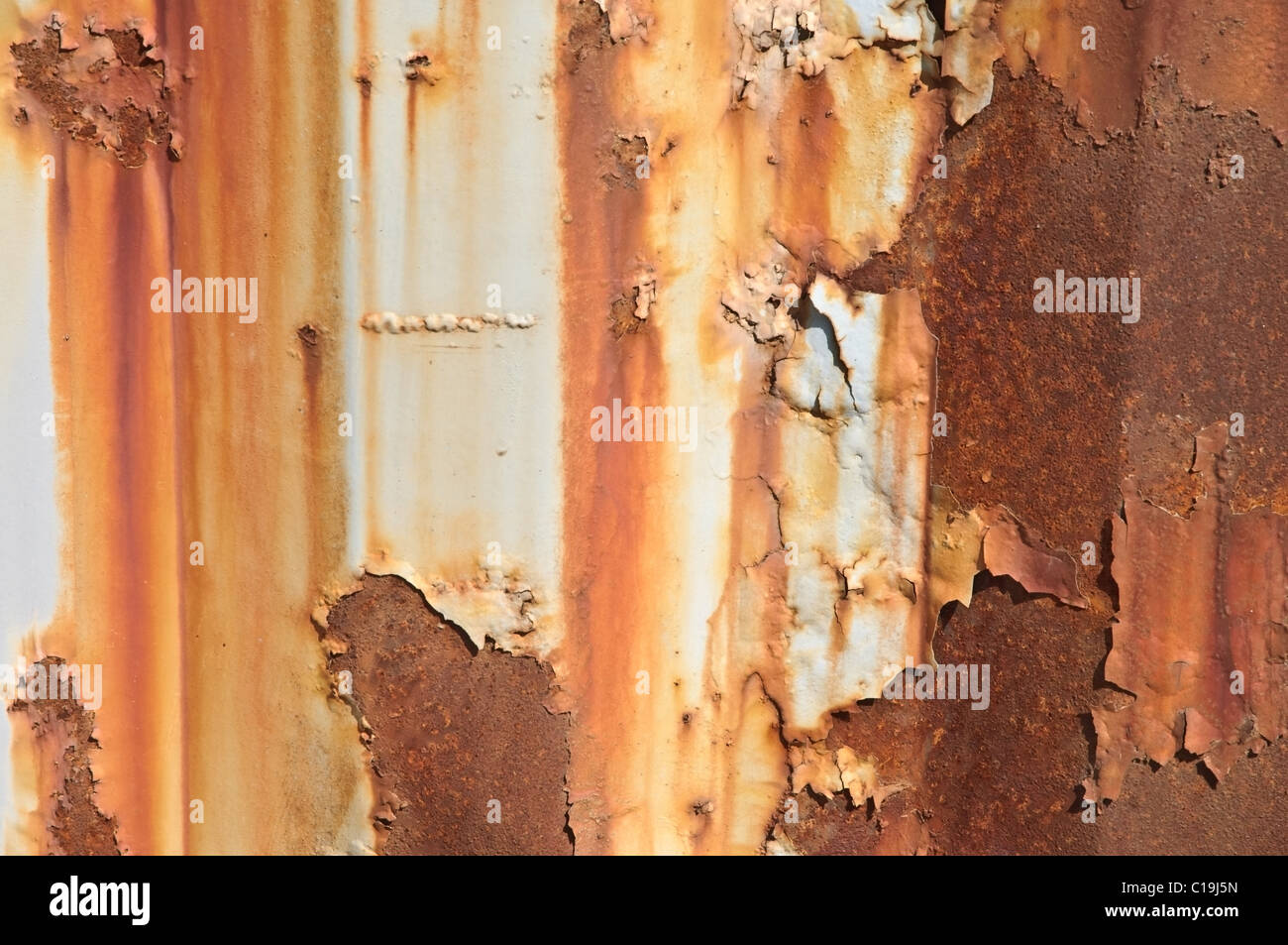 Paint peeling off a rusty metal background Stock Photo Alamy