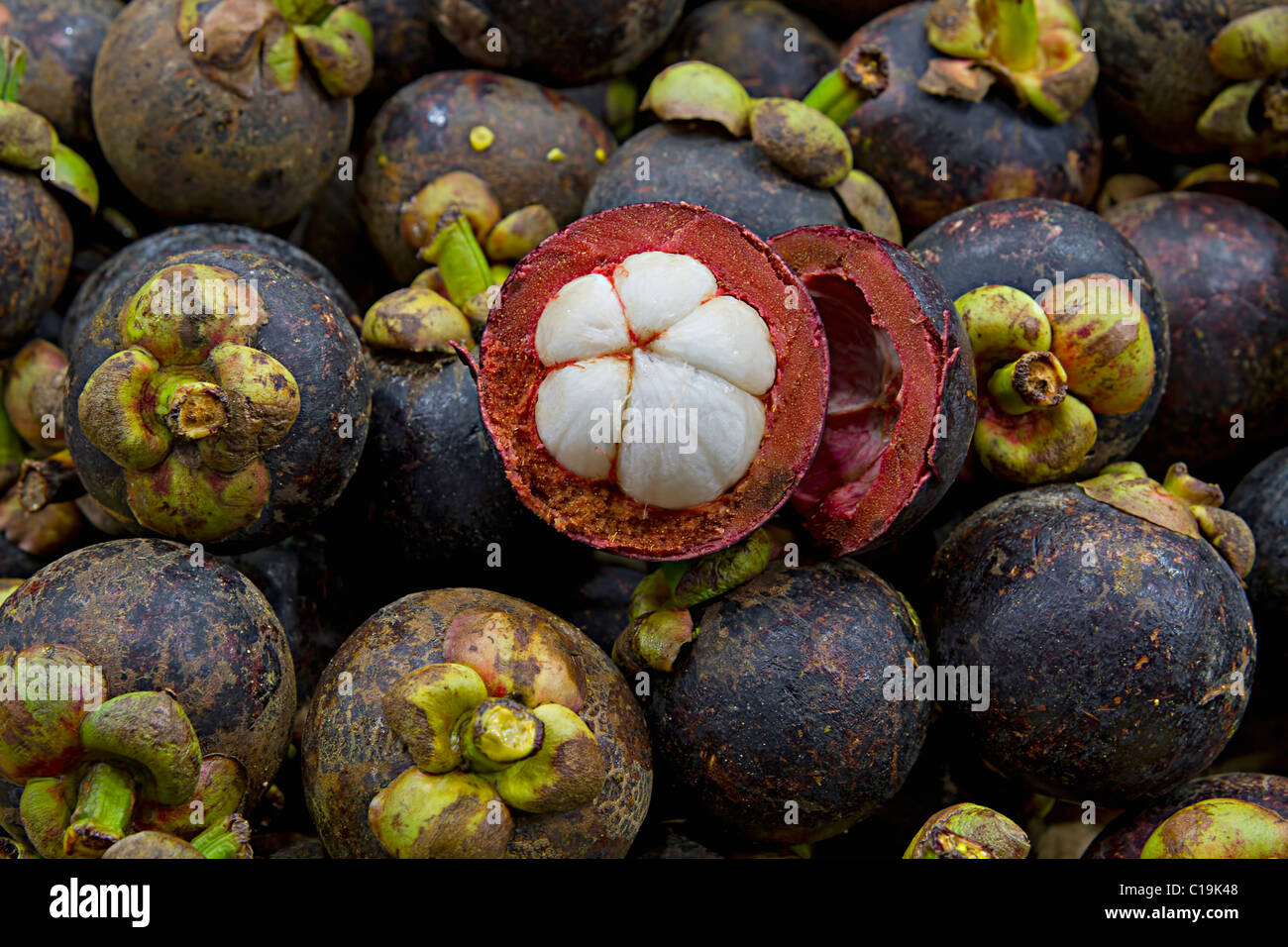 Purple Mangosteen on Fruit Stand in Tropical Country Stock Photo