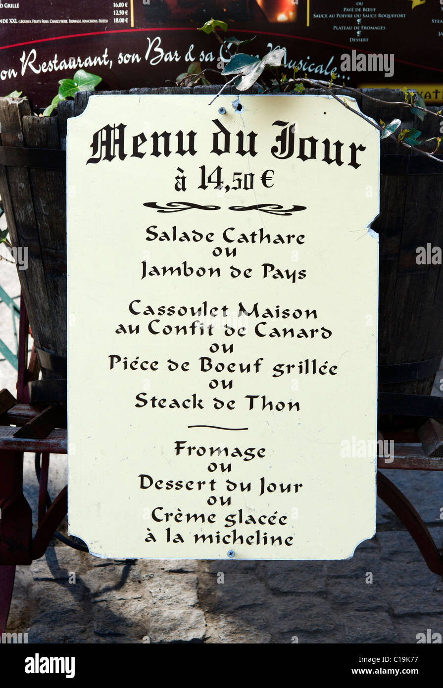 Menu board for the Menu du Jour outside a restaurant in the medieval walled city (Cite) of Carcassonne, Languedoc, France Stock Photo