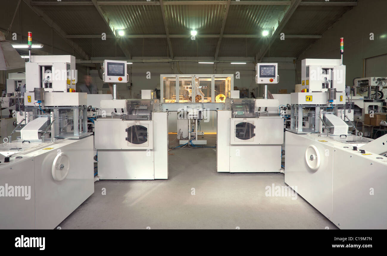 Machines for making handkerchiefs, rolls and serviettes. Stock Photo