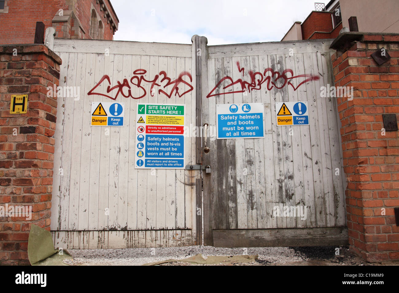 Health & Safety warning signs on a builders yard in a U.K. city. Stock Photo