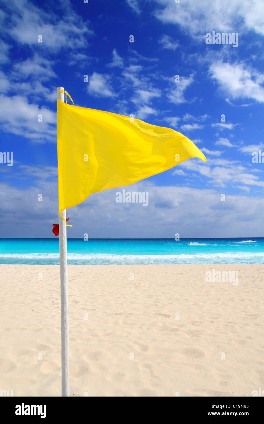 Beach yellow flag weather wind advice Caribbean turquoise sea Stock