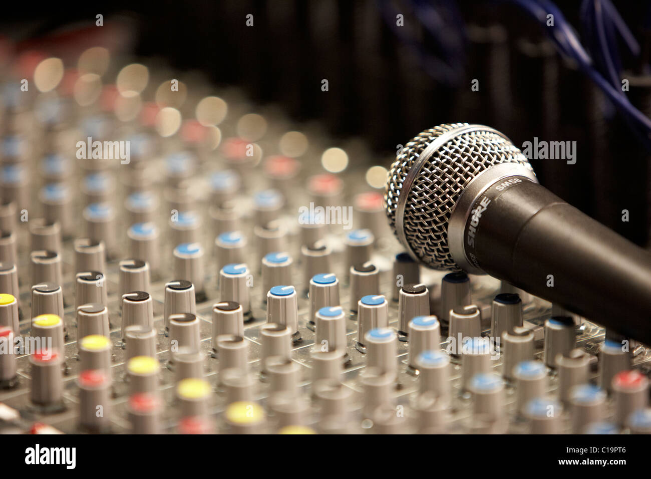 mic on an audio mixing desk in a theatre concert hall Stock Photo Alamy