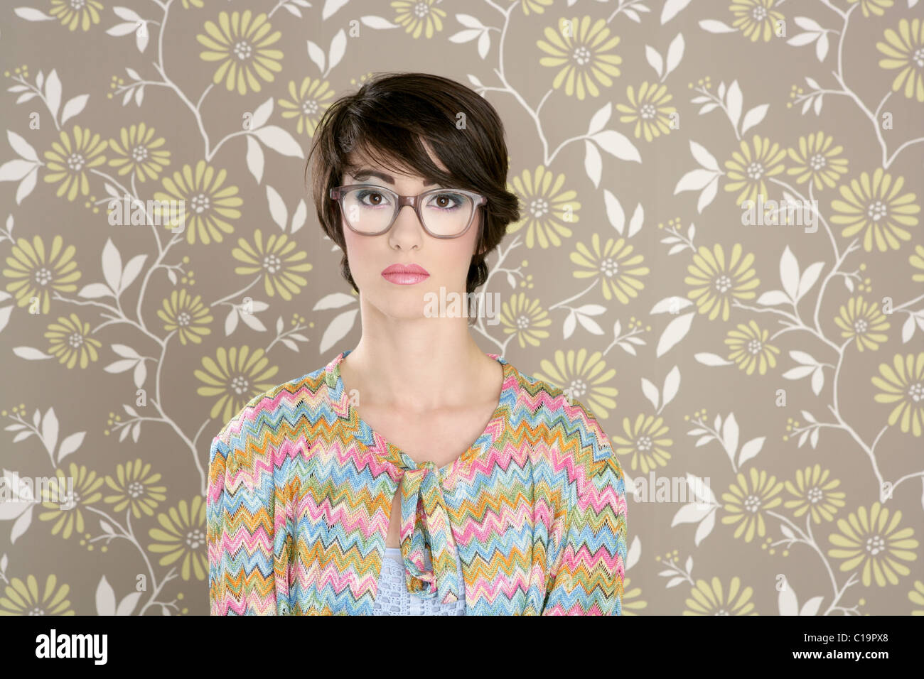 nerd retro woman 60s vintage glasses floral wallpaper Stock Photo