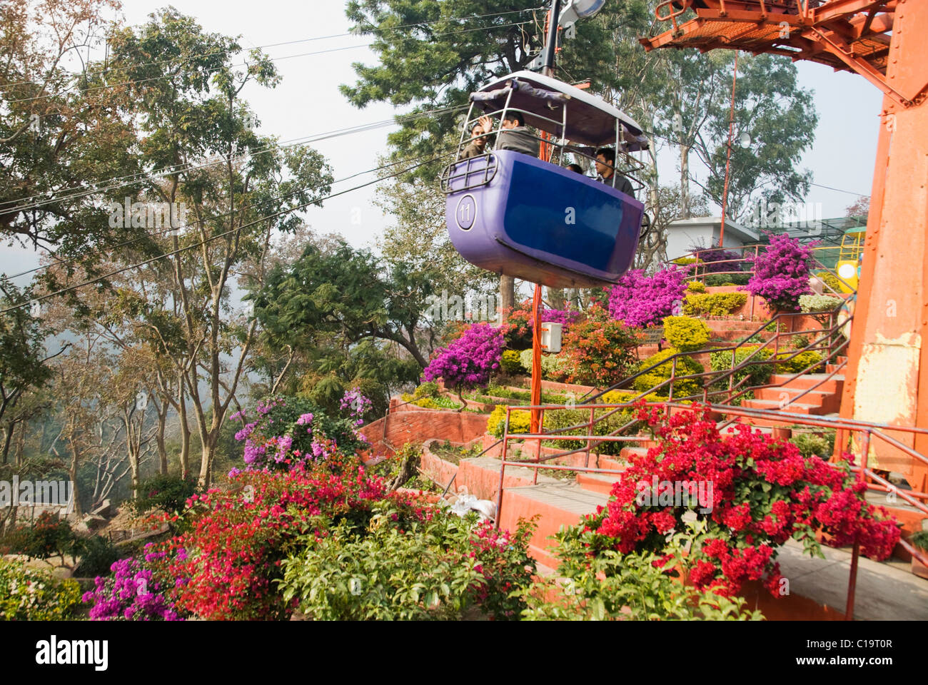 Tourists in an overhead cable car, Haridwar, Uttarakhand, India Stock Photo