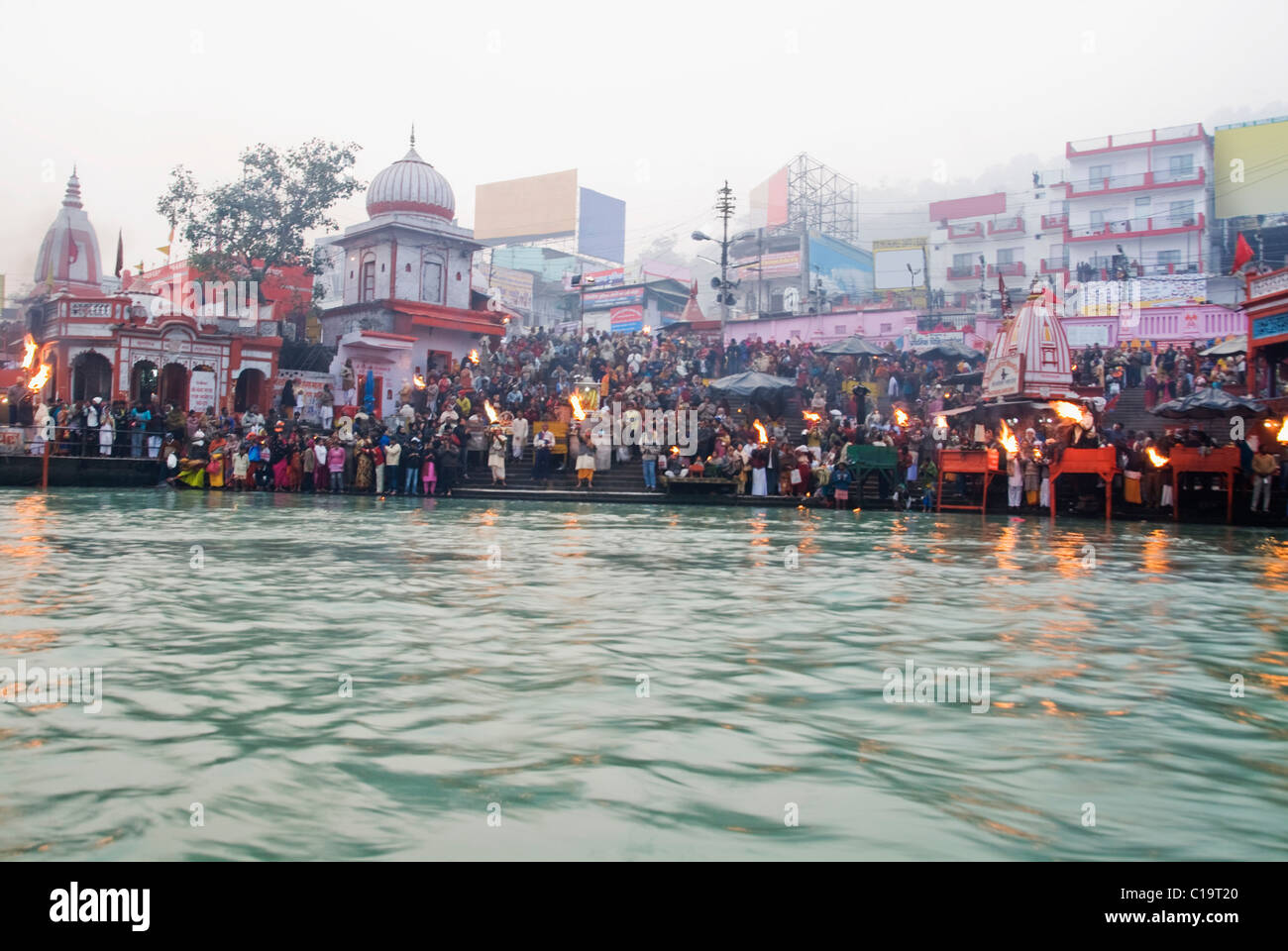 Pilgrims performing aarti at a ghat, Har Ki Pauri, Ganges River, Haridwar, Uttarakhand, India Stock Photo