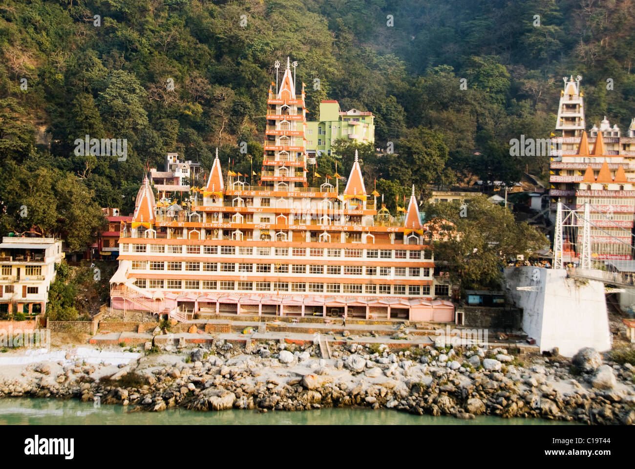 Temples at the riverbank, Swarg Niwas Temple, Ganges River, Rishikesh, Uttarakhand, India Stock Photo