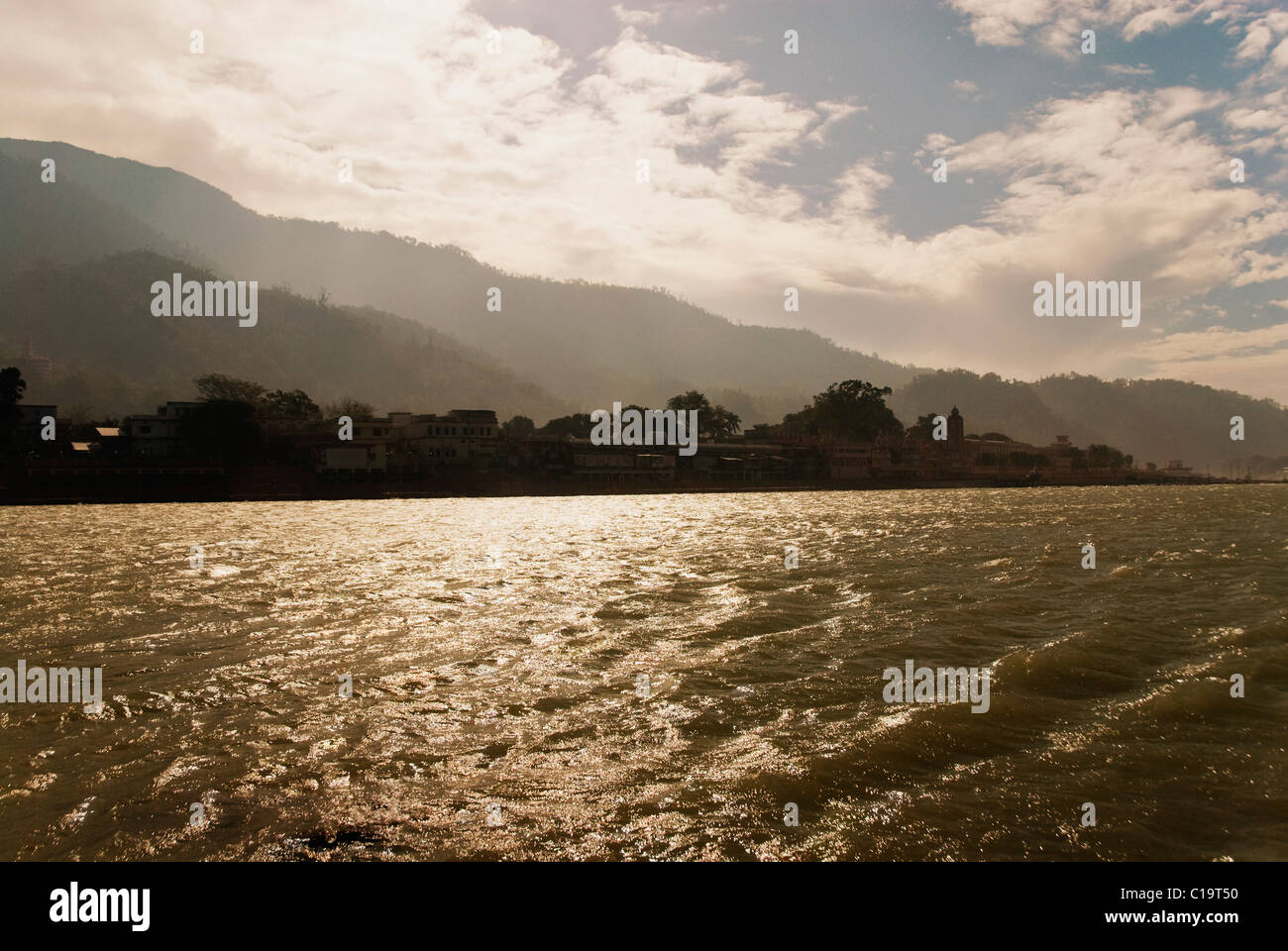 River with mountains in the background, Ganges River, Rishikesh, Uttarakhand, India Stock Photo
