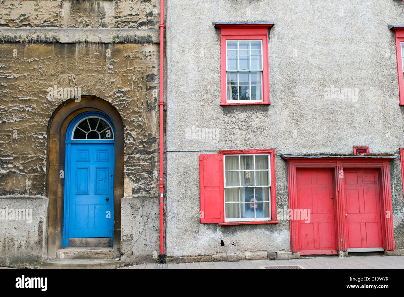 Red and Blue Painted Front Doors and Windows on Houses in Oxford Stock Photo