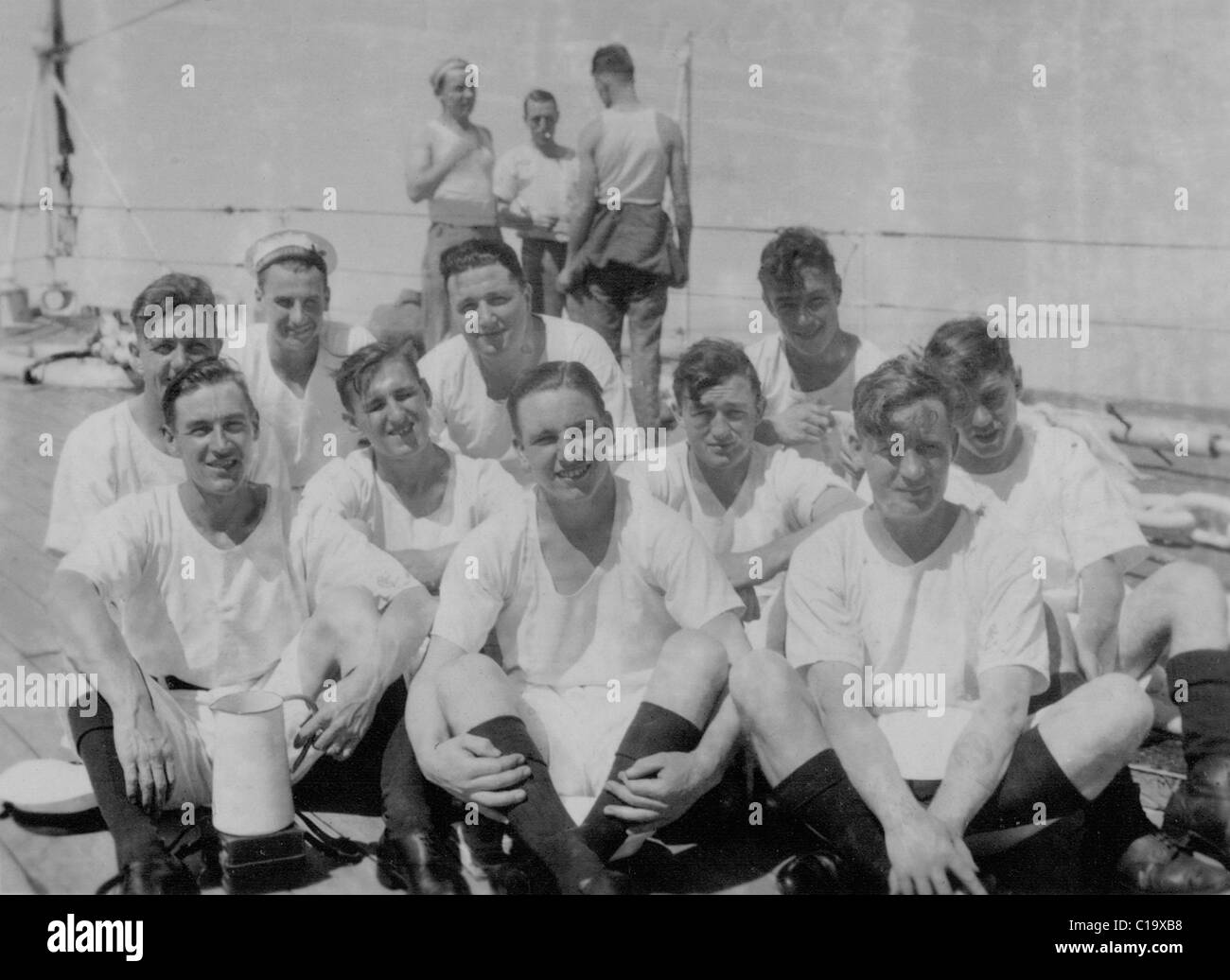 Informal group portrait of British Royal Navy sailors in tropical clothing thought to be HMS Adventure 1936-37 Stock Photo