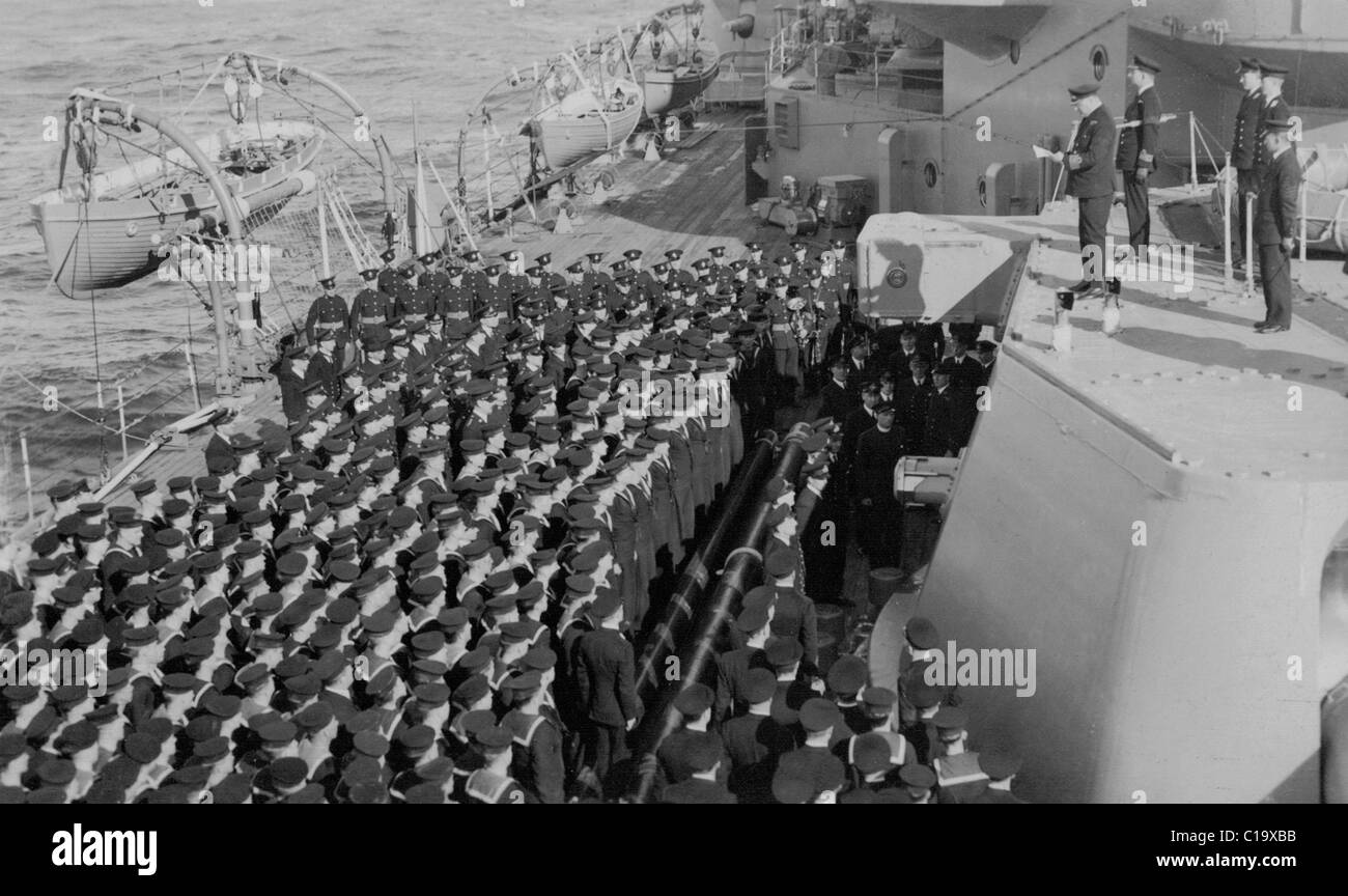 Officer addresses crew British Royal Navy ship late 1930s or early 1940s thought to be HMS Rodney Stock Photo