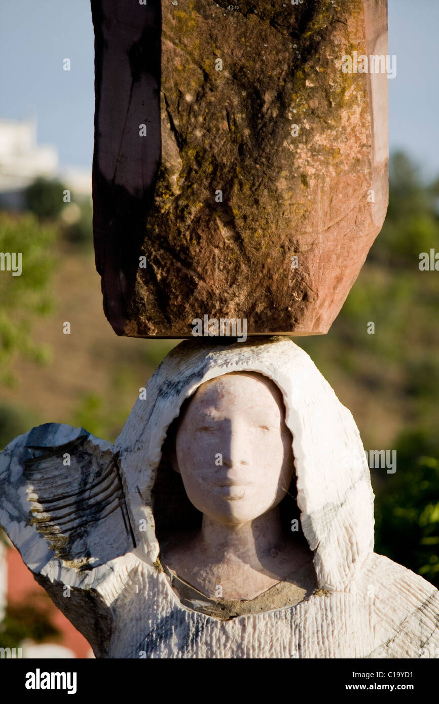 View of a hardworker female class stone statue . Stock Photo