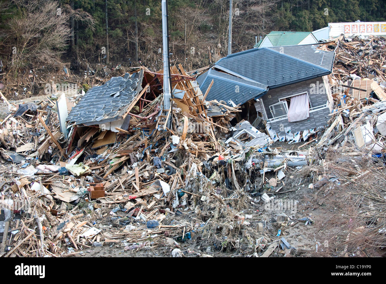 Shattered homes and other debris that was swept inland by the tsunami
