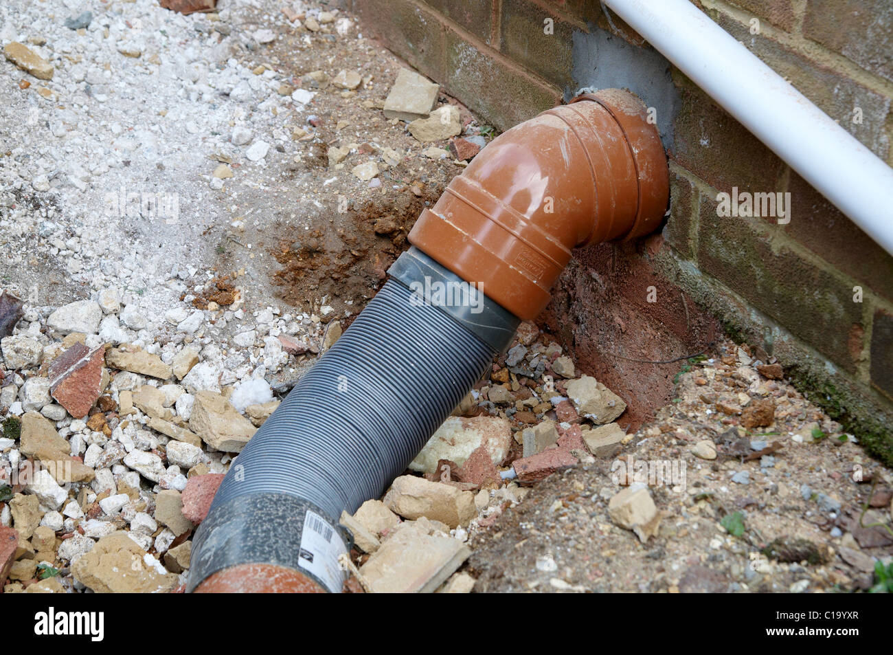 Plastic soil pipe with flexible extension Stock Photo