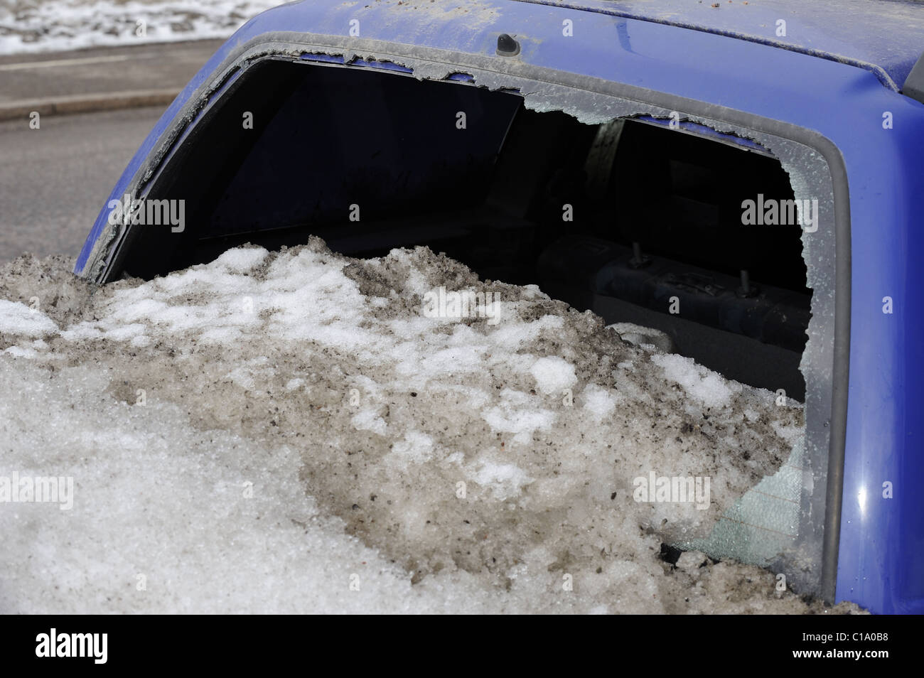 A winter surprise. Some Finns do not use their cars during the wintertime. They just park their cars by the side of the street.. Stock Photo