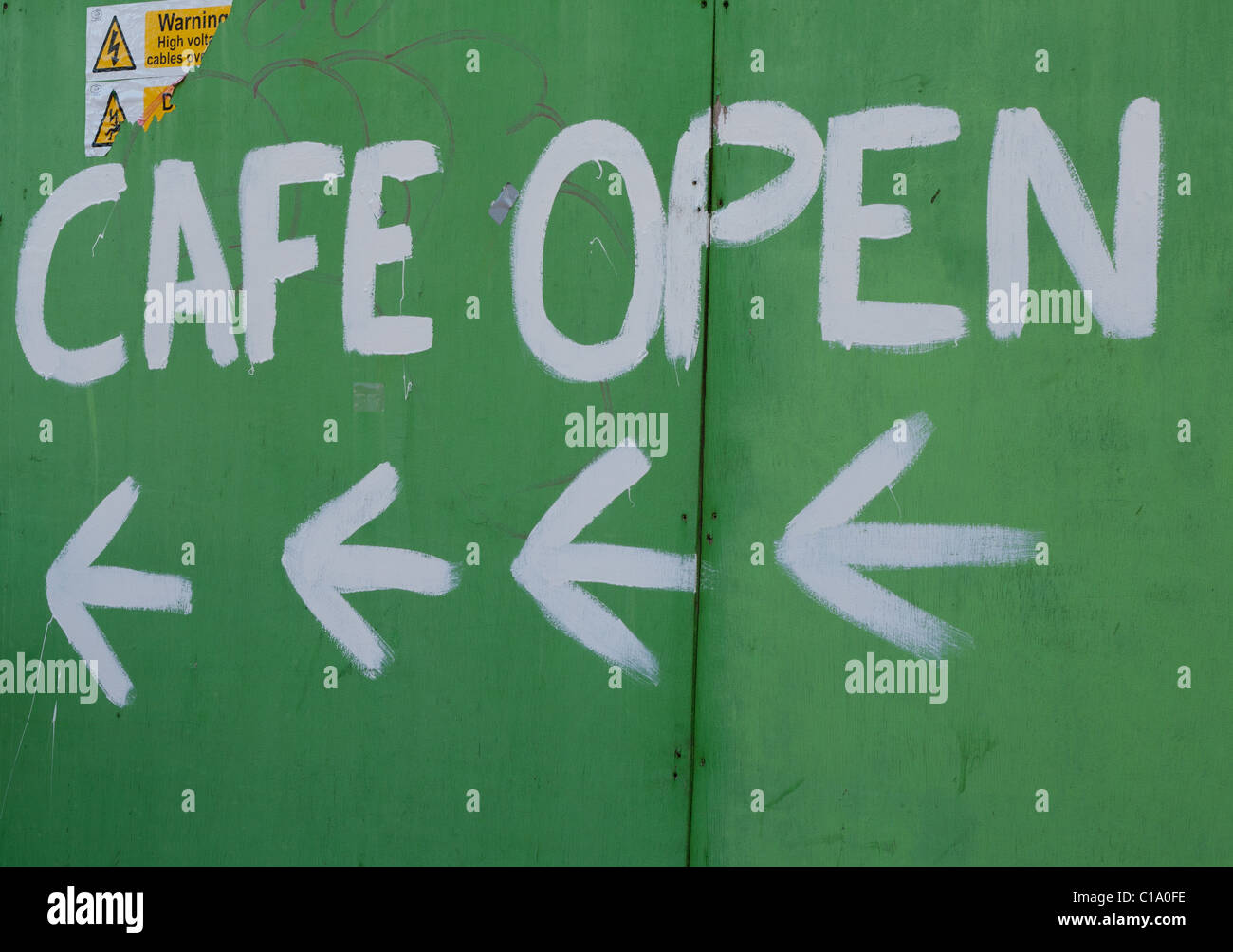 Sign with Cafe Open and arrows on a green board Stock Photo