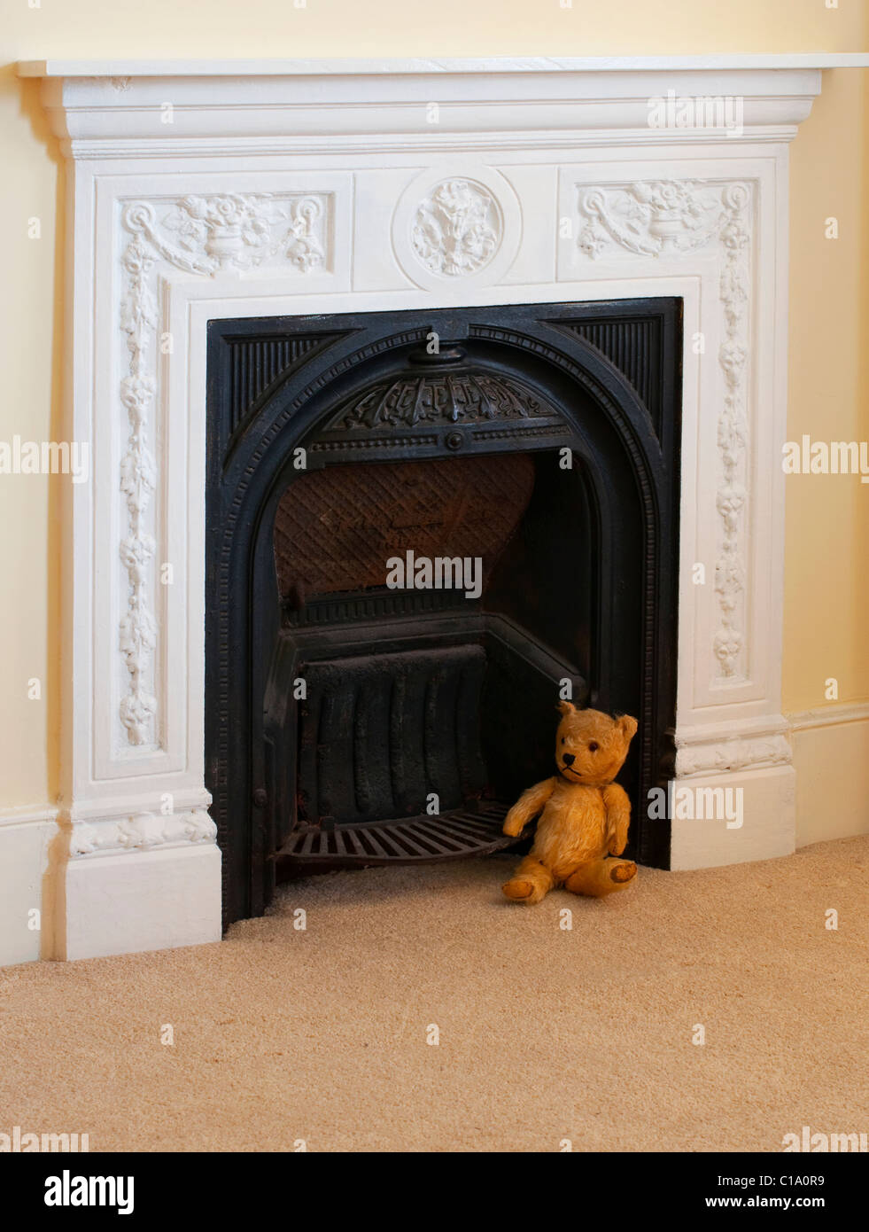 Victorian Fireplace In Bedroom With An Old Antique Teddy Bear